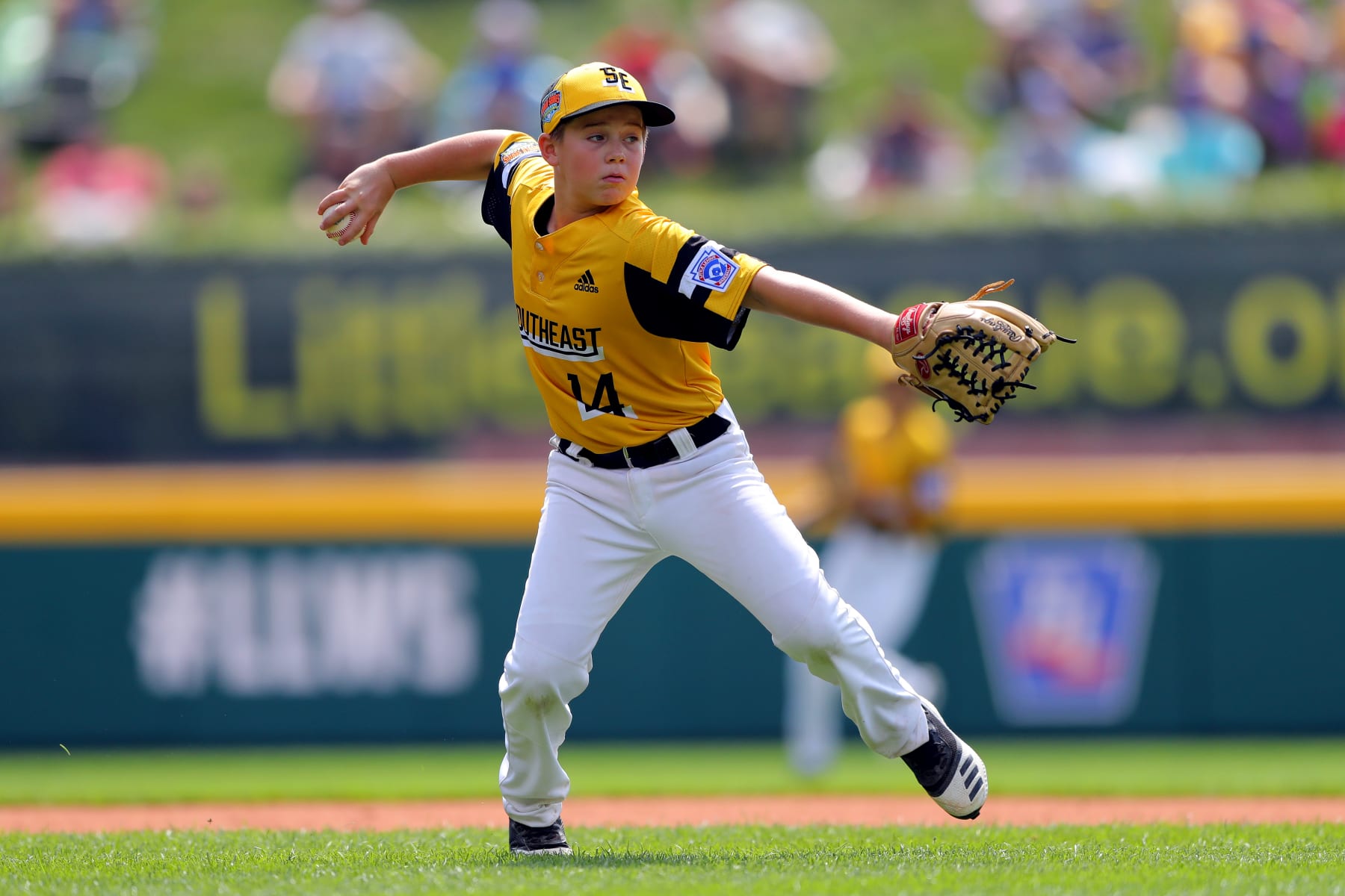 SOUTH WILLIAMSPORT, PA - AUGUST 16: Brody Harris #14 of the Southeast Region team from South Riding, Virginia fields a ground ball during Game 2 of the 2019 Little League World Series against the New England Region team from Barrington, Rhode Island at Lamade Stadium on Friday, August 16, 2019 in South Williamsport, Pennsylvania. (Photo by Alex Trautwig/MLB Photos via Getty Images)