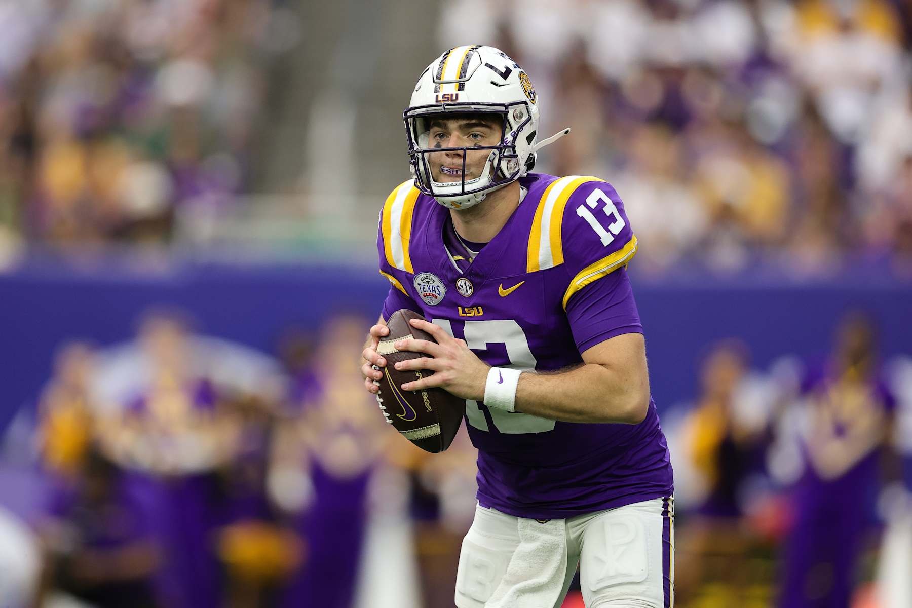 HOUSTON, TEXAS - DECEMBER 31: Garrett Nussmeier #13 of the LSU Tigers looks to pass the ball against the Baylor Bears during the first half in the Kinder's Texas Bowl at NRG Stadium on December 31, 2024 in Houston, Texas. (Photo by Alex Slitz/Getty Images)