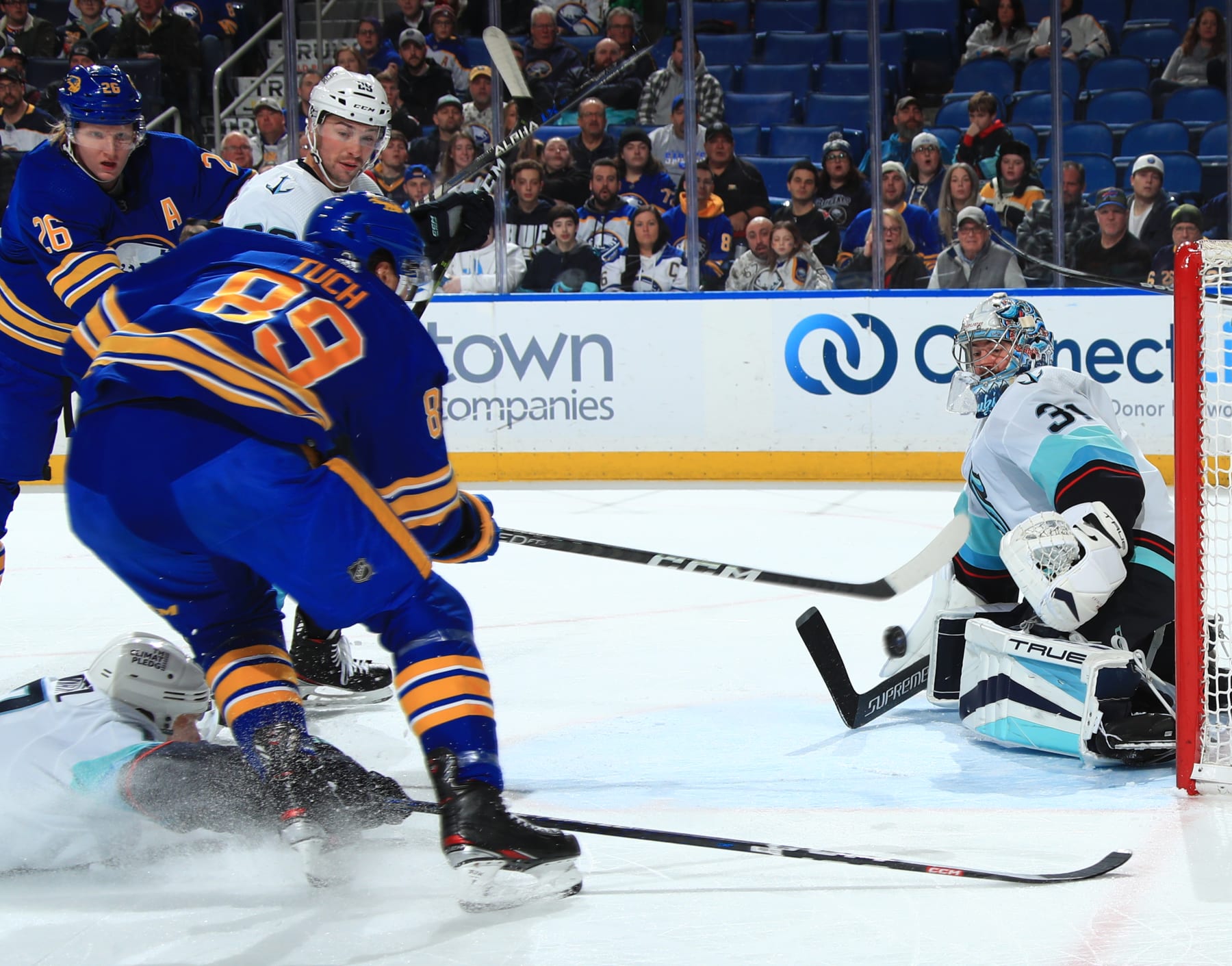 BUFFALO, NY - JANUARY 10: Alex Tuch #89 of the Buffalo Sabres scores a first period goal against Philipp Grubauer #31 of the Seattle Kraken during an NHL game on January 10, 2023 at KeyBank Center in Buffalo, New York. (Photo by Bill Wippert/NHLI via Getty Images)