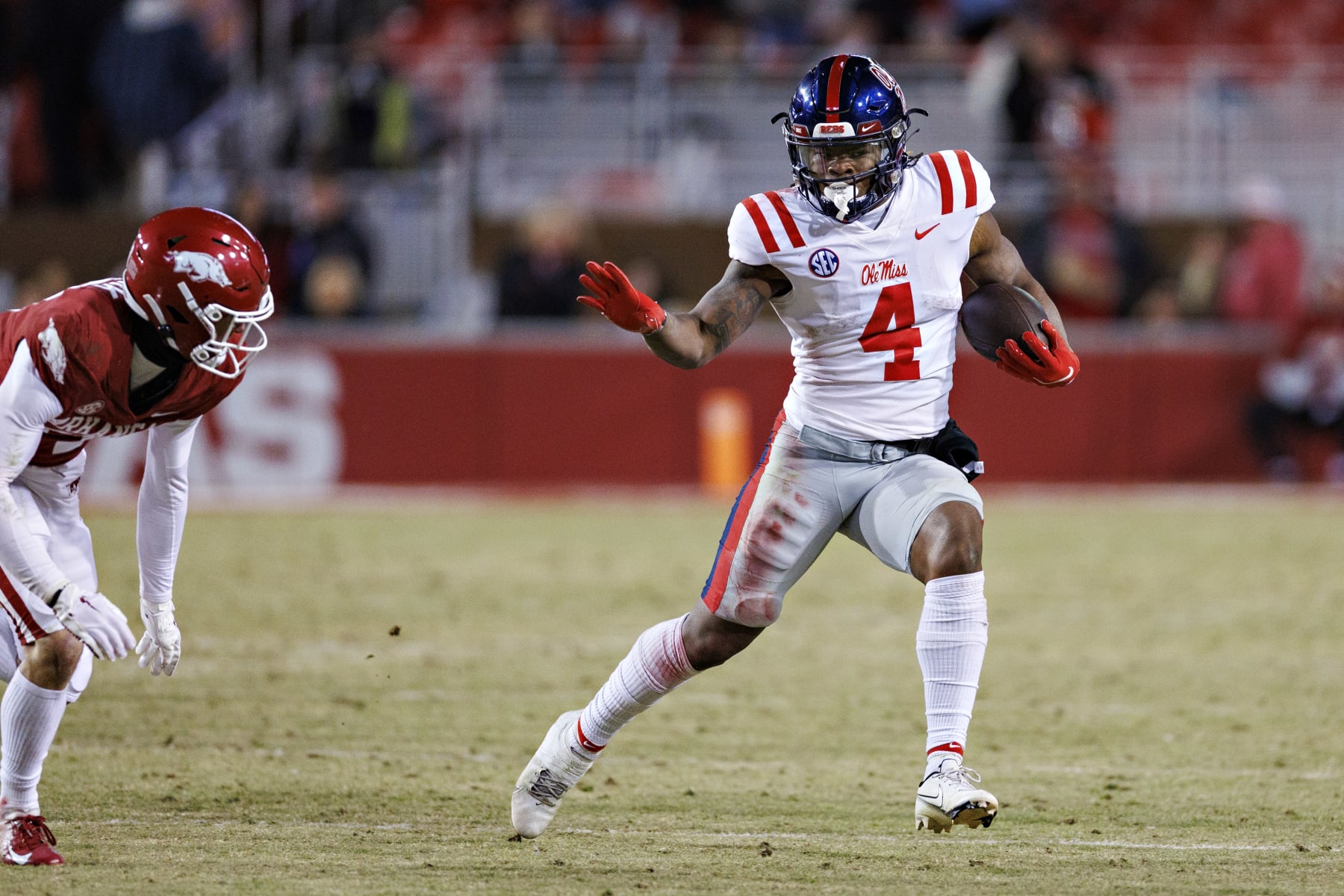 FAYETTEVILLE, ARKANSAS - NOVEMBER 19: Quinshon Judkins #4 of the Mississippi Rebels runs the ball during a game against the Arkansas Razorbacks at Donald W. Reynolds Razorback Stadium on November 19, 2022 in Fayetteville, Arkansas. The Razorbacks defeated the Rebels 42-27.  (Photo by Wesley Hitt/Getty Images)