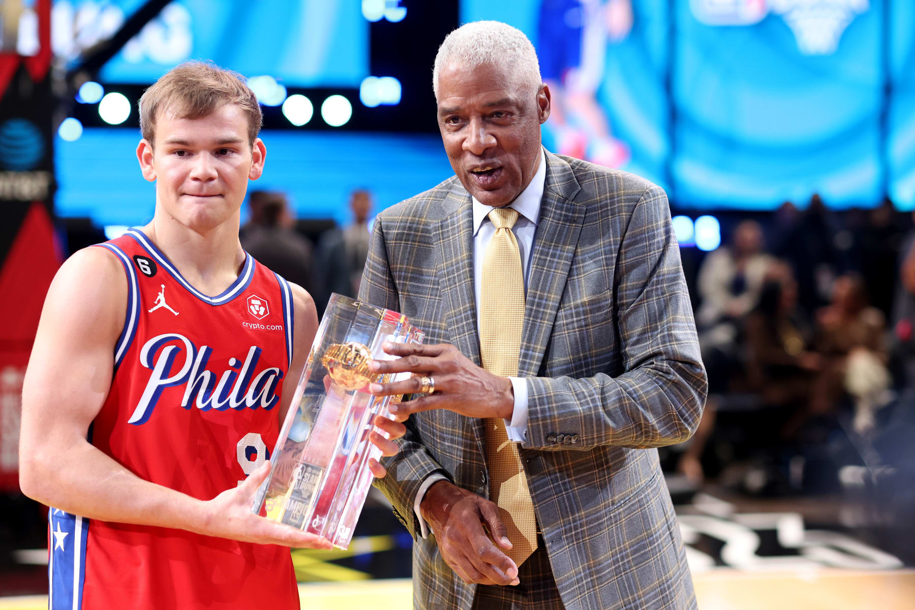 SALT LAKE CITY, UTAH - FEBRUARY 18: Mac McClung #9 of the Philadelphia 76ers and former professional basketball player Julius Erving pose with the trophy after McClung's victory in the 2023 NBA All Star AT&T Slam Dunk Contest at Vivint Arena on February 18, 2023 in Salt Lake City, Utah. NOTE TO USER: User expressly acknowledges and agrees that, by downloading and or using this photograph, User is consenting to the terms and conditions of the Getty Images License Agreement. (Photo by Tim Nwachukwu/Getty Images)