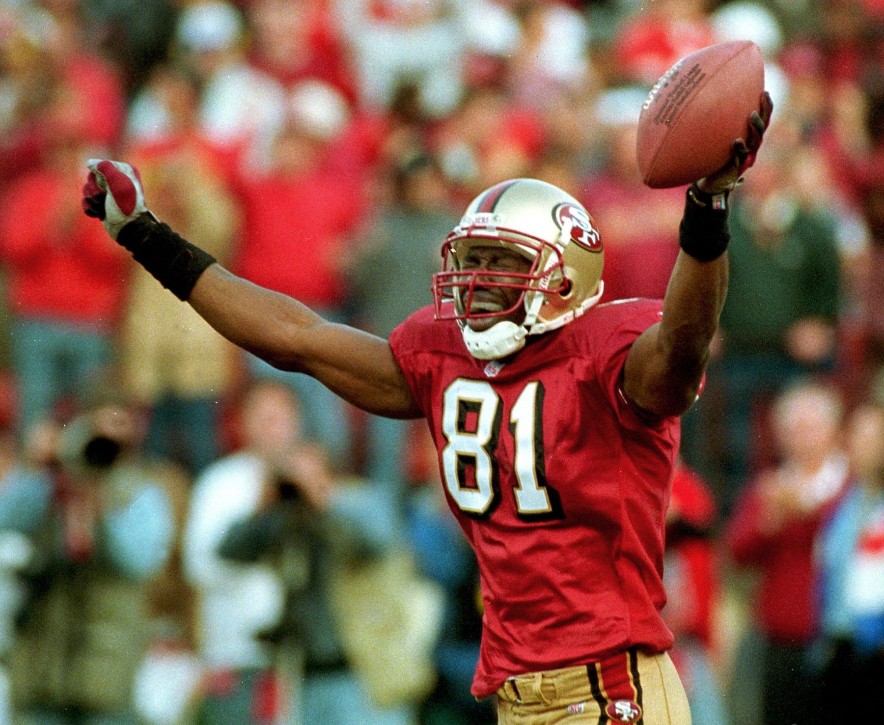 SAN FRANCISCO, UNITED STATES:  San Francisco 49ers wide receiver Terrell Owens celebrates after catching the game-winning pass from 49ers quarterback Steve Young in the final seconds of their NFC Wild Card playoff game with the Green Bay Packers 03 January. The 49ers defeated the Packers 30-27. AFP PHOTO/Monica M. DAVEY (Photo credit should read MONICA M. DAVEY/AFP via Getty Images)
