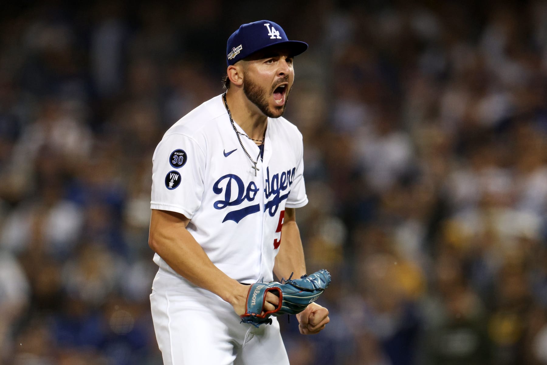LOS ANGELES, CALIFORNIA - OCTOBER 11: Alex Vesia #51 of the Los Angeles Dodgers celebrates after a strike out to end the top of the seventh inning in game one of the National League Division Series against the San Diego Padres at Dodger Stadium on October 11, 2022 in Los Angeles, California. (Photo by Harry How/Getty Images)