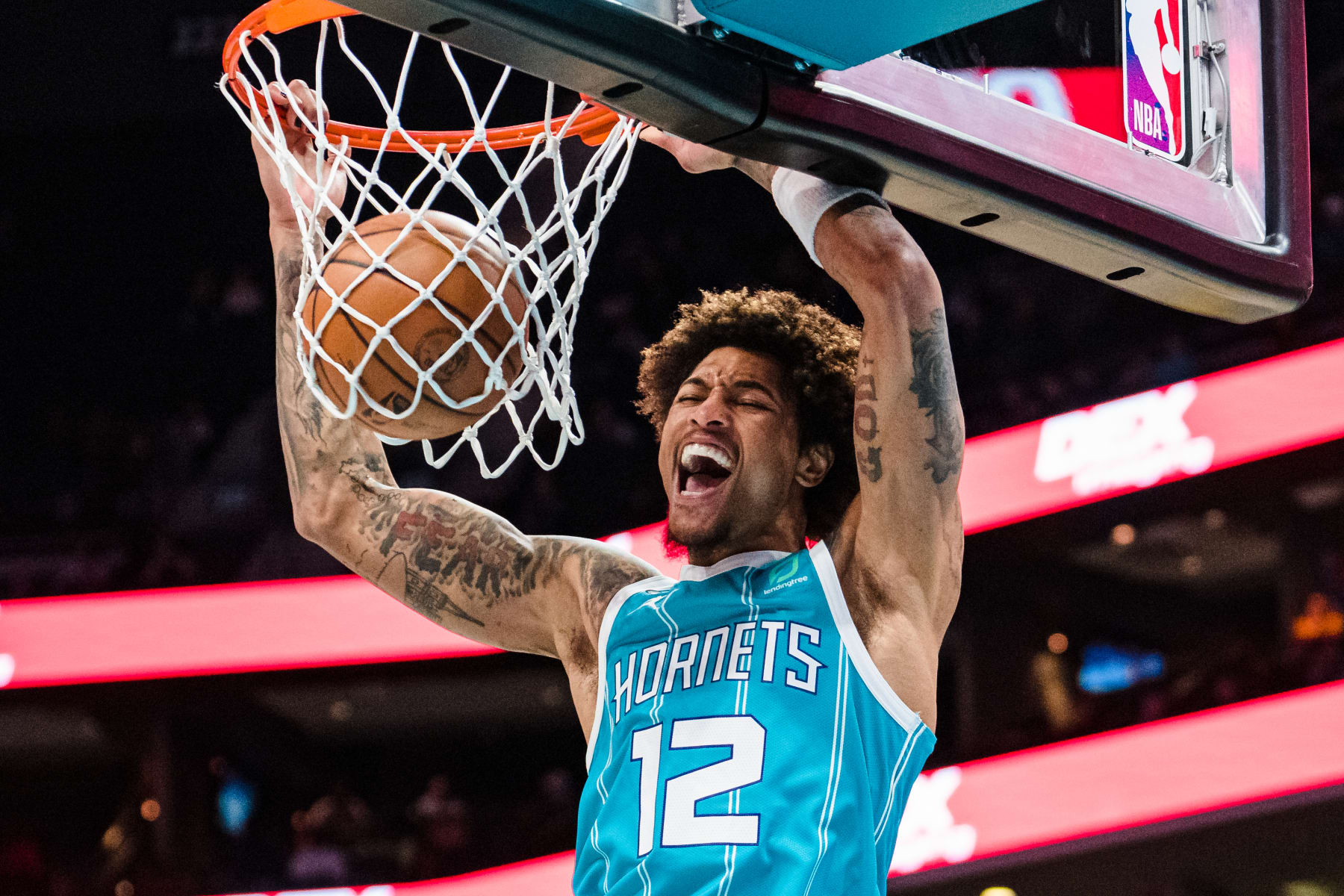 CHARLOTTE, NORTH CAROLINA - MARCH 20: Kelly Oubre Jr. #12 of the Charlotte Hornets dunks the ball in the second quarter during their game against the Indiana Pacers at Spectrum Center on March 20, 2023 in Charlotte, North Carolina. NOTE TO USER: User expressly acknowledges and agrees that, by downloading and or using this photograph, User is consenting to the terms and conditions of the Getty Images License Agreement. (Photo by Jacob Kupferman/Getty Images)