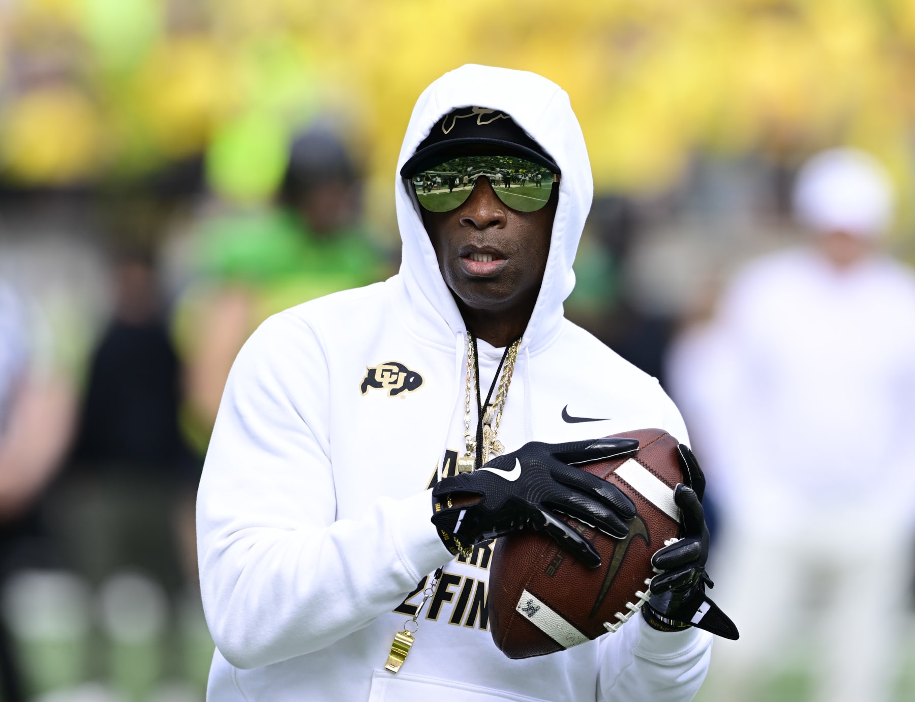 EUGENE, OR - SEPTEMBER 23: Colorado Buffaloes head coach Deion Sanders plays a little catch on the field just before warmups before playing the Oregon Ducks at Autzen Stadium September 23, 2023. (Photo by Andy Cross/MediaNews Group/The Denver Post via Getty Images)