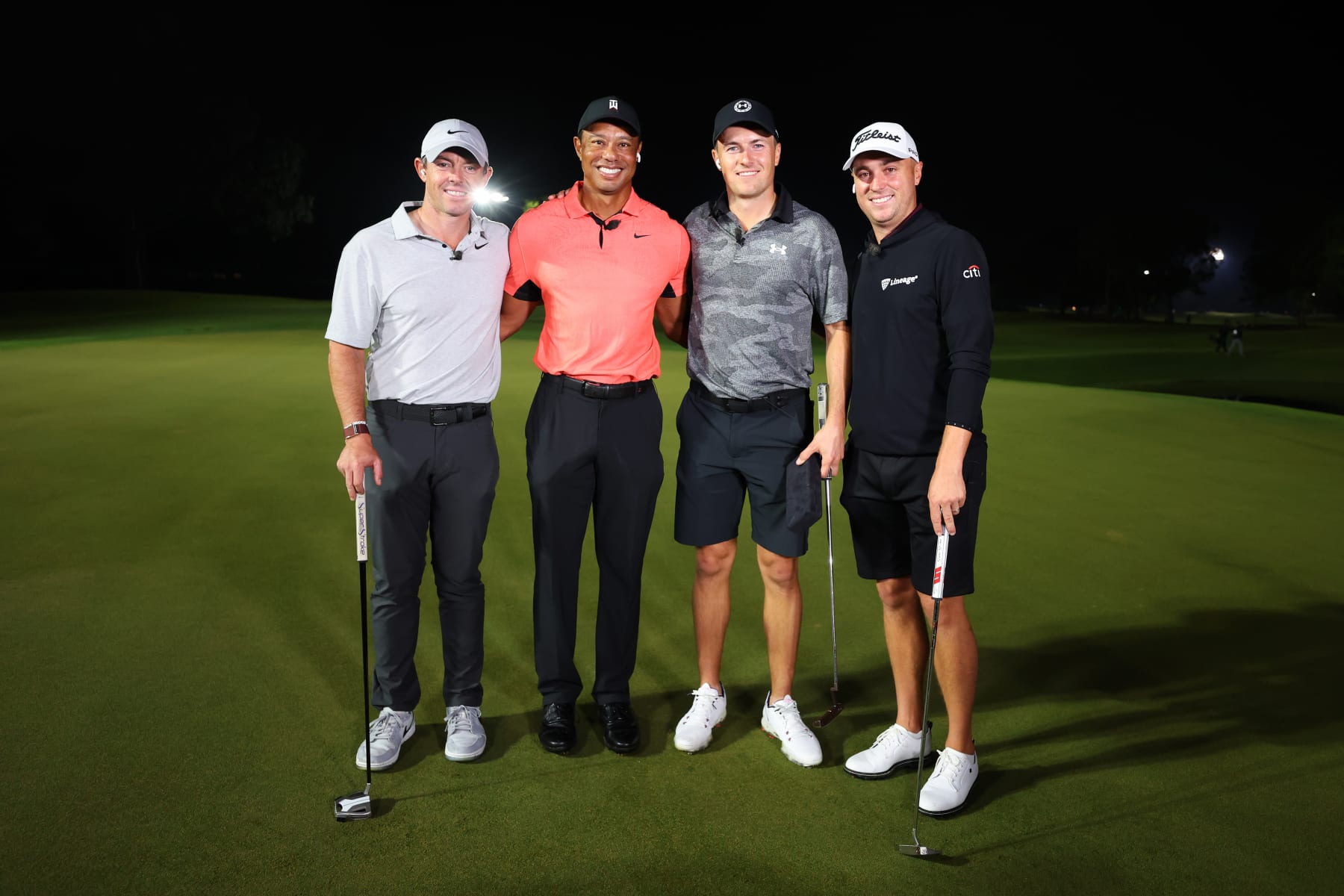 BELLEAIR, FLORIDA - DECEMBER 10:  (L-R) Rory McIlroy of Northern Ireland and Tiger Woods of the United States pose with Jordan Spieth of the United States and Justin Thomas of the United States after Spieth and Thomas defeated McIlroy and Woods during The Match 7 at Pelican at Pelican Golf Club on December 10, 2022 in Belleair, Florida. (Photo by Mike Ehrmann/Getty Images for The Match)