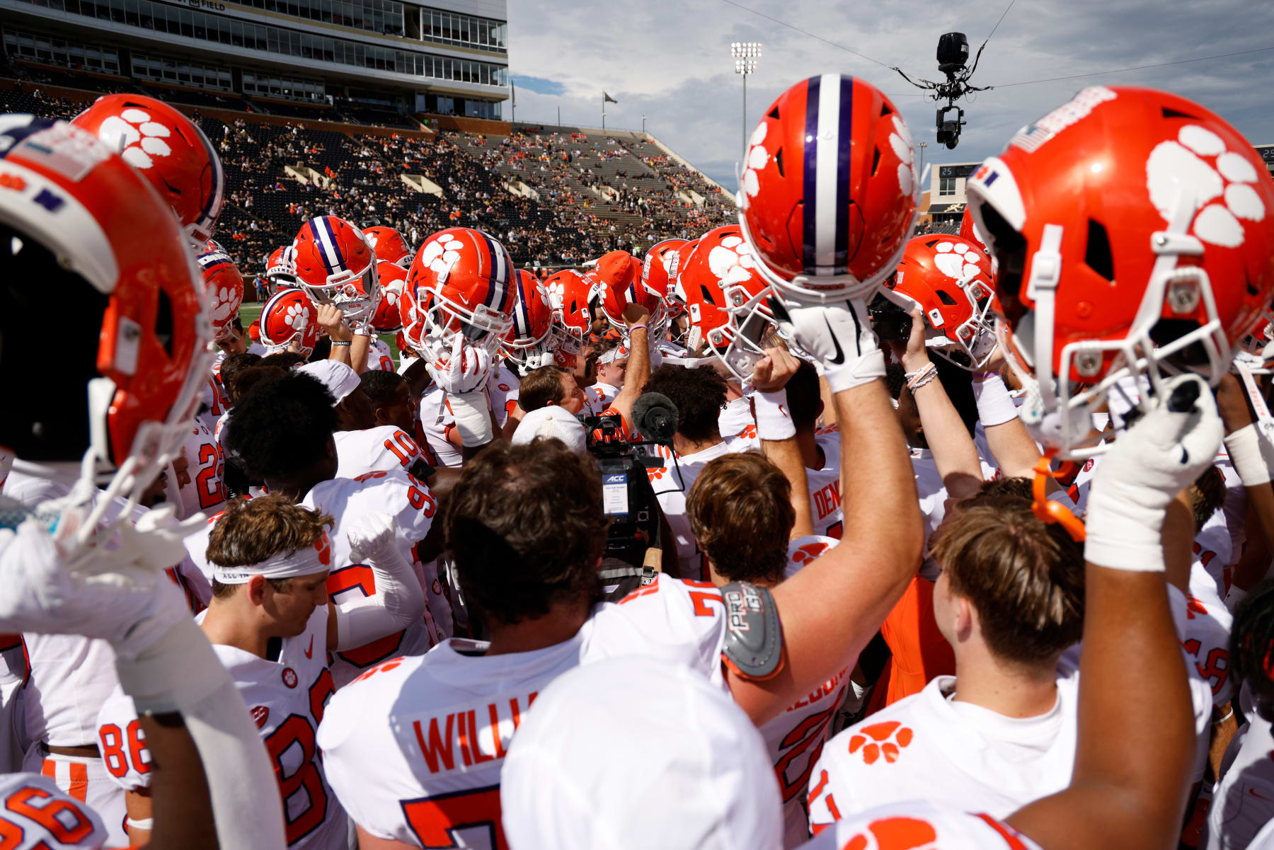 WINSTON-SALEM, NC - SEPTEMBER 24: Players of the Clemson Tigers raise their helmets prior to their game against the Wake Forest Demon Deacons at Truist Field on September 24, 2022 in Winston-Salem, North Carolina. Clemson won 51-45 in 2OT. (Photo by Lance King/Getty Images)