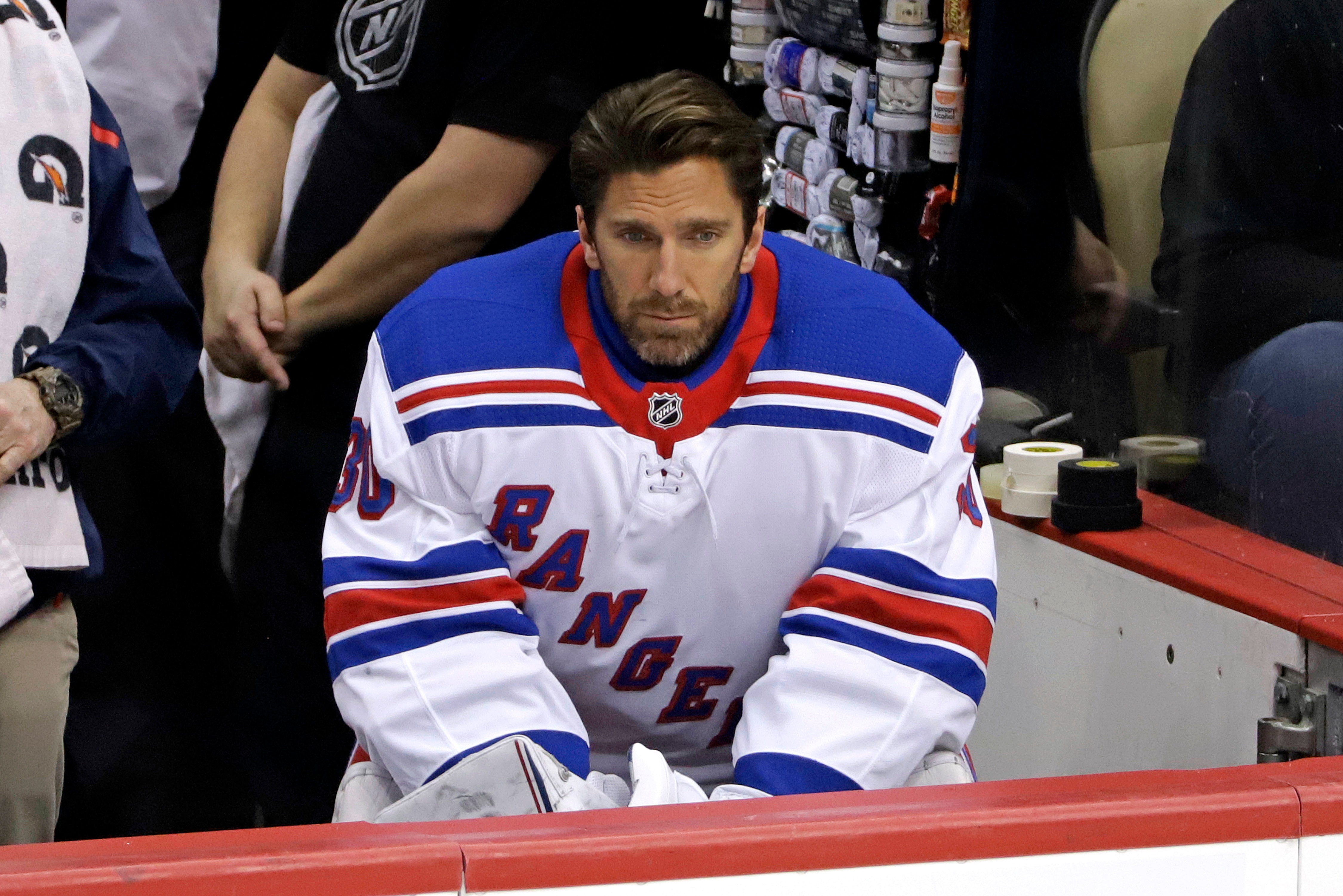 New York Rangers' Henrik Lundqvist sits on the bench during the first period of an NHL hockey game against the Pittsburgh Penguins in Pittsburgh, Sunday, Feb. 17, 2019. The Penguins won 6-5. (AP Photo/Gene J. Puskar)