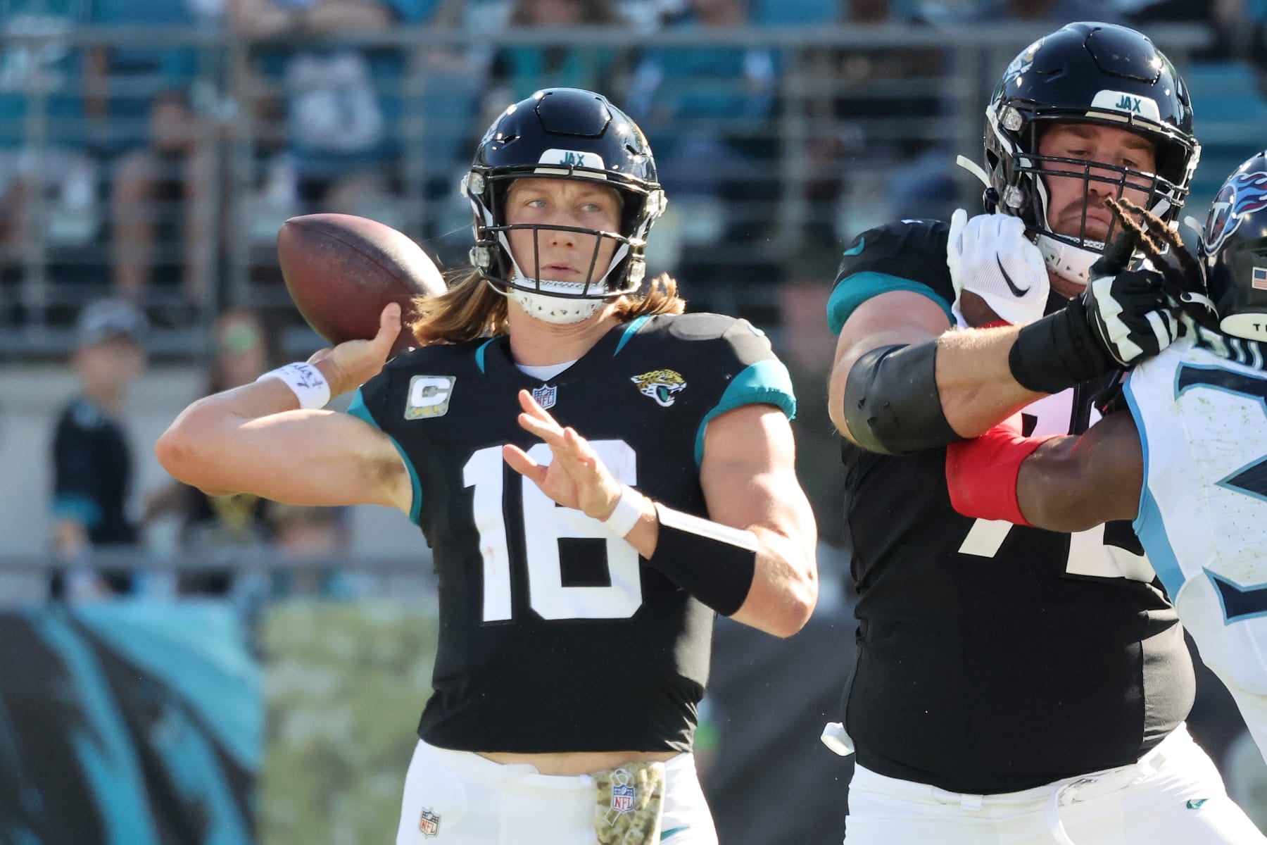 JACKSONVILLE, FLORIDA - NOVEMBER 19: Trevor Lawrence #16 of the Jacksonville Jaguars throws a pass in the second quarter against the Tennessee Titans at EverBank Stadium on November 19, 2023 in Jacksonville, Florida. (Photo by Mike Carlson/Getty Images)