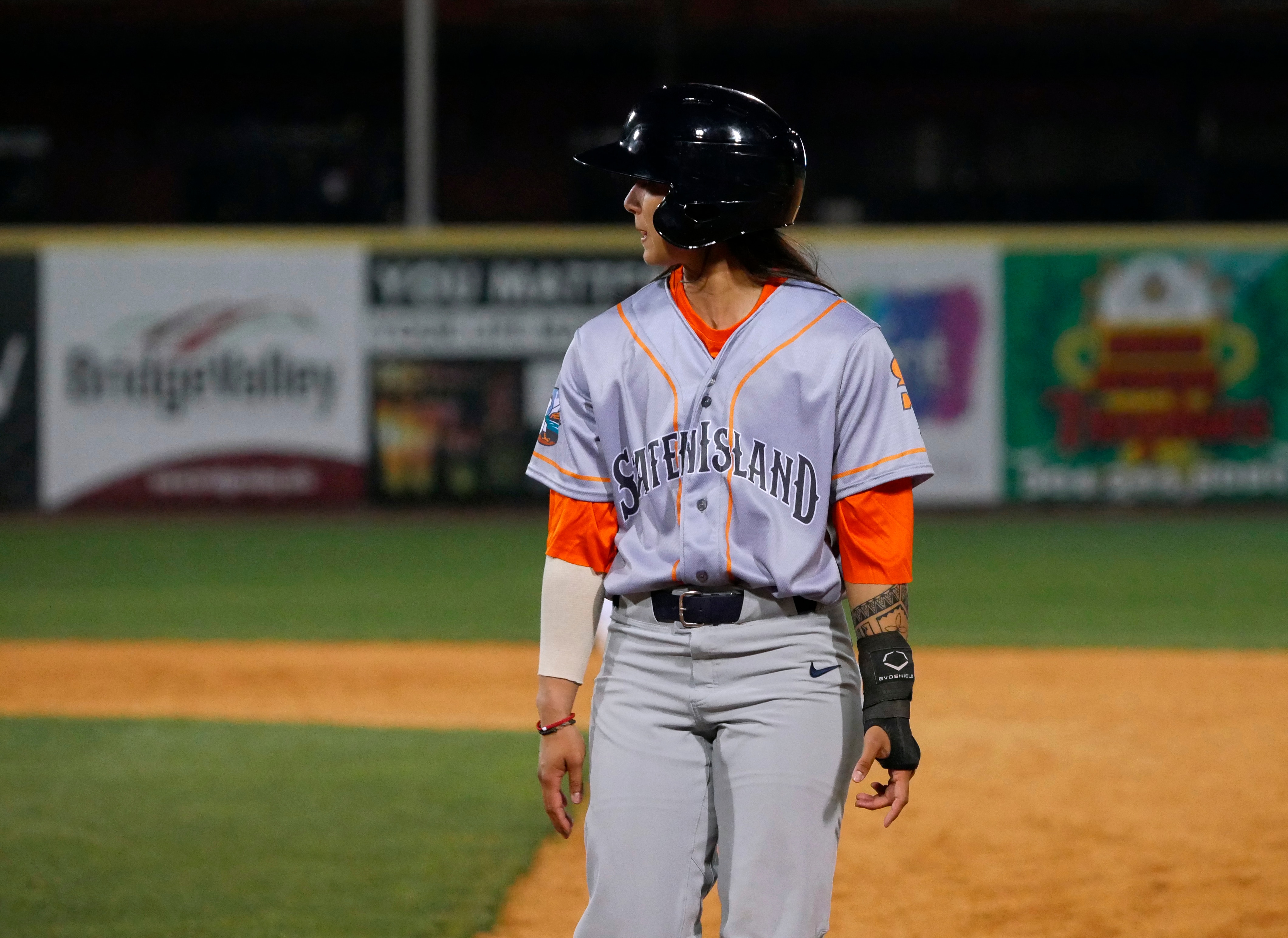 In this photo provided by Joseph Langan, pinch-runner Kelsie Whitmore walks back to first during the team's baseball game against the Charleston Dirty Birds on Thursday, April 21, 2022, in Charleston, W.Va. Whitmore played left field and batted ninth for the FerryHawks in Gastonia, N.C., Sunday, May 1, 2022, becoming the first woman to start a game in the Atlantic League and one of the first to do so in a league connected to Major League Baseball. (Joseph Langan via AP)