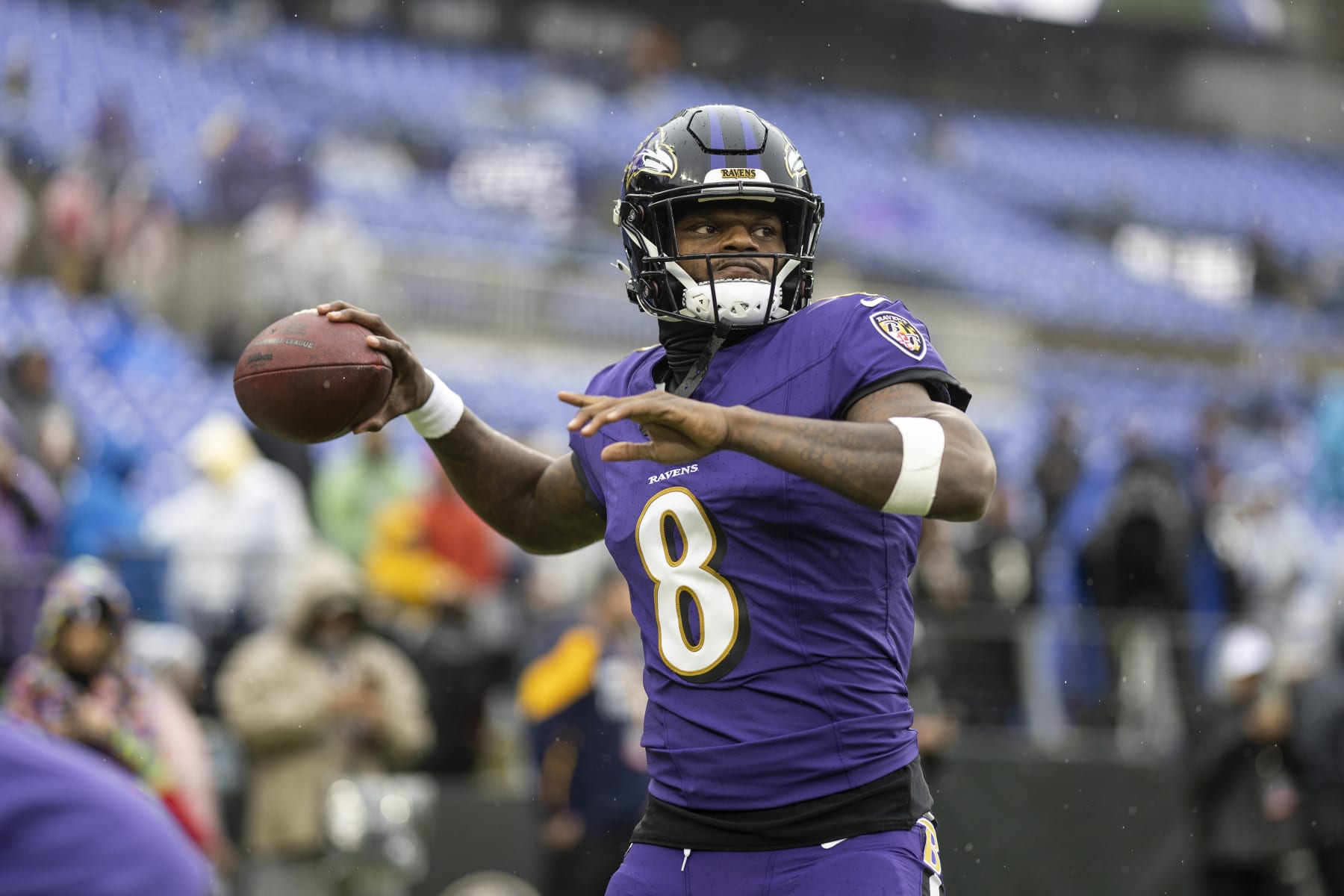 BALTIMORE, MARYLAND - DECEMBER 10: Lamar Jackson #8 of the Baltimore Ravens throws a pass as he warms up prior to an NFL football game between the Baltimore Ravens and the Los Angeles Rams at M&T Bank Stadium on December 10, 2023 in Baltimore, Maryland. (Photo by Michael Owens/Getty Images)