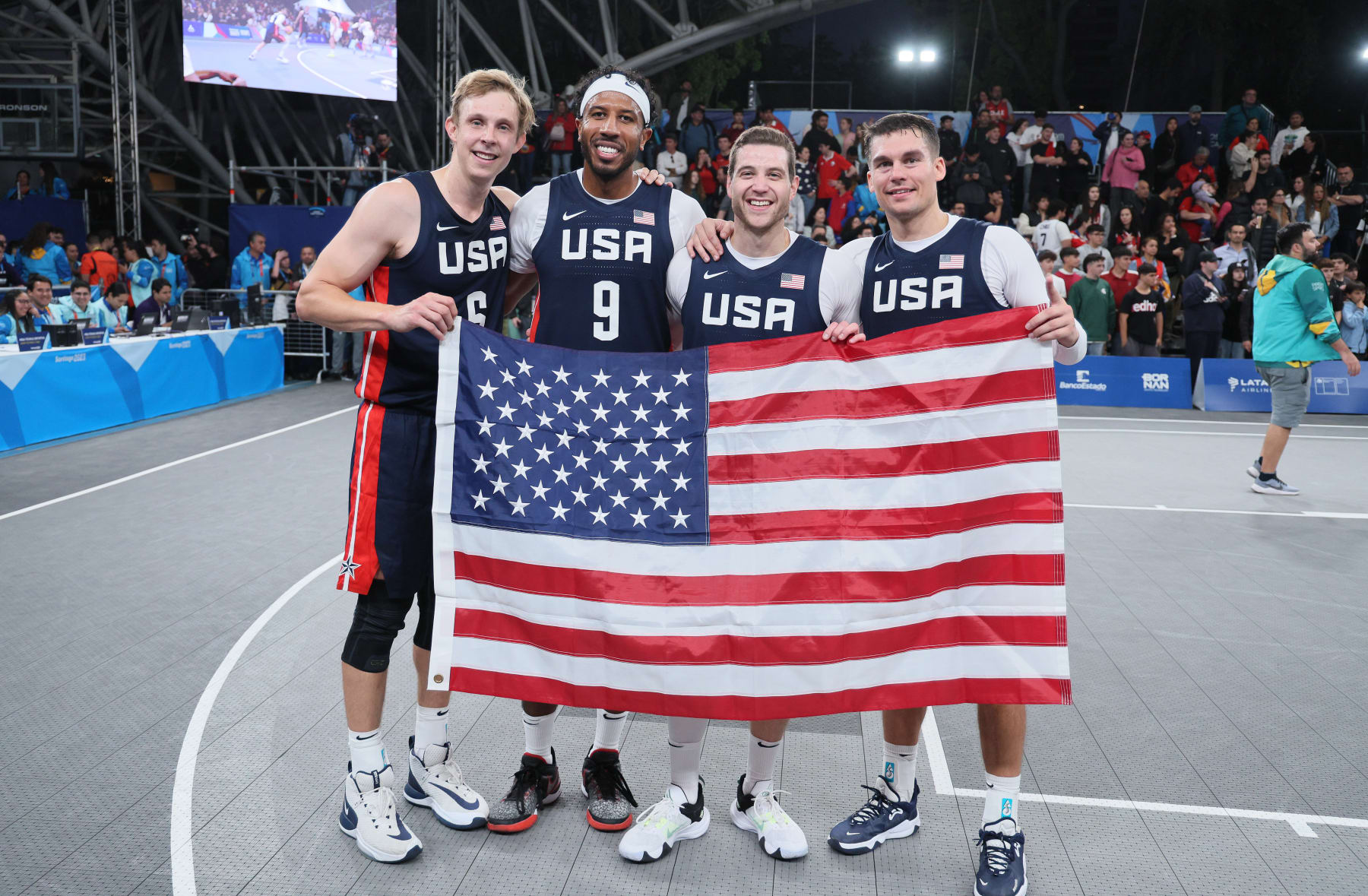 SANTIAGO, CHILE - OCTOBER 23: Canyon Barry, Dylan Travis, Jimmer Fredette and Kareem Maddox of Team USA after winning the Gold Medal Game of  Men's Basketball 3x3 at Estadio Espanol on Day 3 of Santiago 2023 Pan Am Games on October 23, 2023 in Santiago, Chile. (Photo by Andy Lyons/Getty Images)