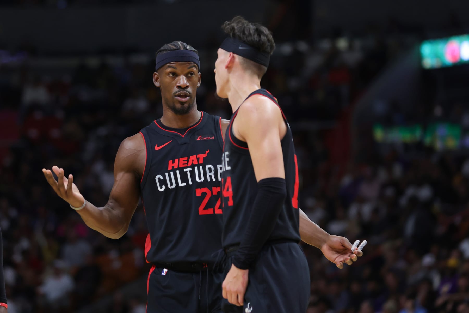 MIAMI, FLORIDA - NOVEMBER 06: Jimmy Butler #22 and Tyler Herro #14 of the Miami Heat speak on the court during the first quarter against the Los Angeles Lakers at Kaseya Center on November 06, 2023 in Miami, Florida. NOTE TO USER: User expressly acknowledges and agrees that, by downloading and or using this photograph, User is consenting to the terms and conditions of the Getty Images License Agreement. (Photo by Megan Briggs/Getty Images)