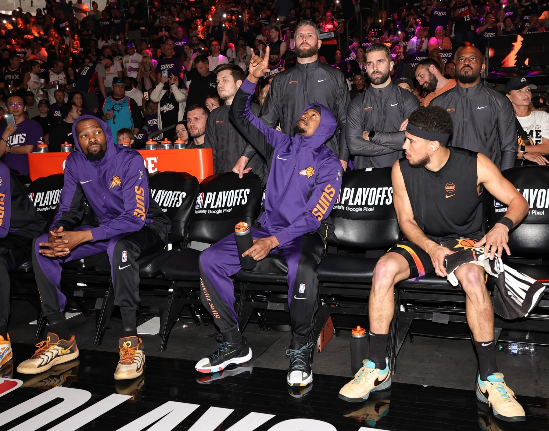 PHOENIX, AZ - APRIL 28: Bradley Beal #3, Kevin Durant #35, and Devin Booker #1 of the Phoenix Suns look on before the game against the Minnesota Timberwolves during Round 1 Game 4 on April 28, 2024 at the Footprint Center in Phoenix, Arizona. NOTE TO USER: User expressly acknowledges and agrees that, by downloading and/or using this Photograph, user is consenting to the terms and conditions of the Getty Images License Agreement. Mandatory Copyright Notice: Copyright 2024 NBAE (Photo by Jim Poorten/NBAE via Getty Images)