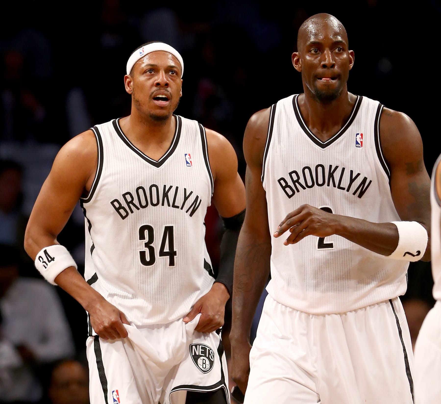 NEW YORK, NY - APRIL 25: Paul Pierce #34 and Kevin Garnett #2 of the Brooklyn Nets walks on the court in the first half against the Toronto Raptors in Game Three of the Eastern Conference Quarterfinals during the 2014 NBA Playoffs at the Barclays Center on April 25, 2014 in the Brooklyn borough of New York City. NOTE TO USER: User expressly acknowledges and agrees that, by downloading and/or using this photograph, user is consenting to the terms and conditions of the Getty Images License Agreement.  (Photo by Elsa/Getty Images) 