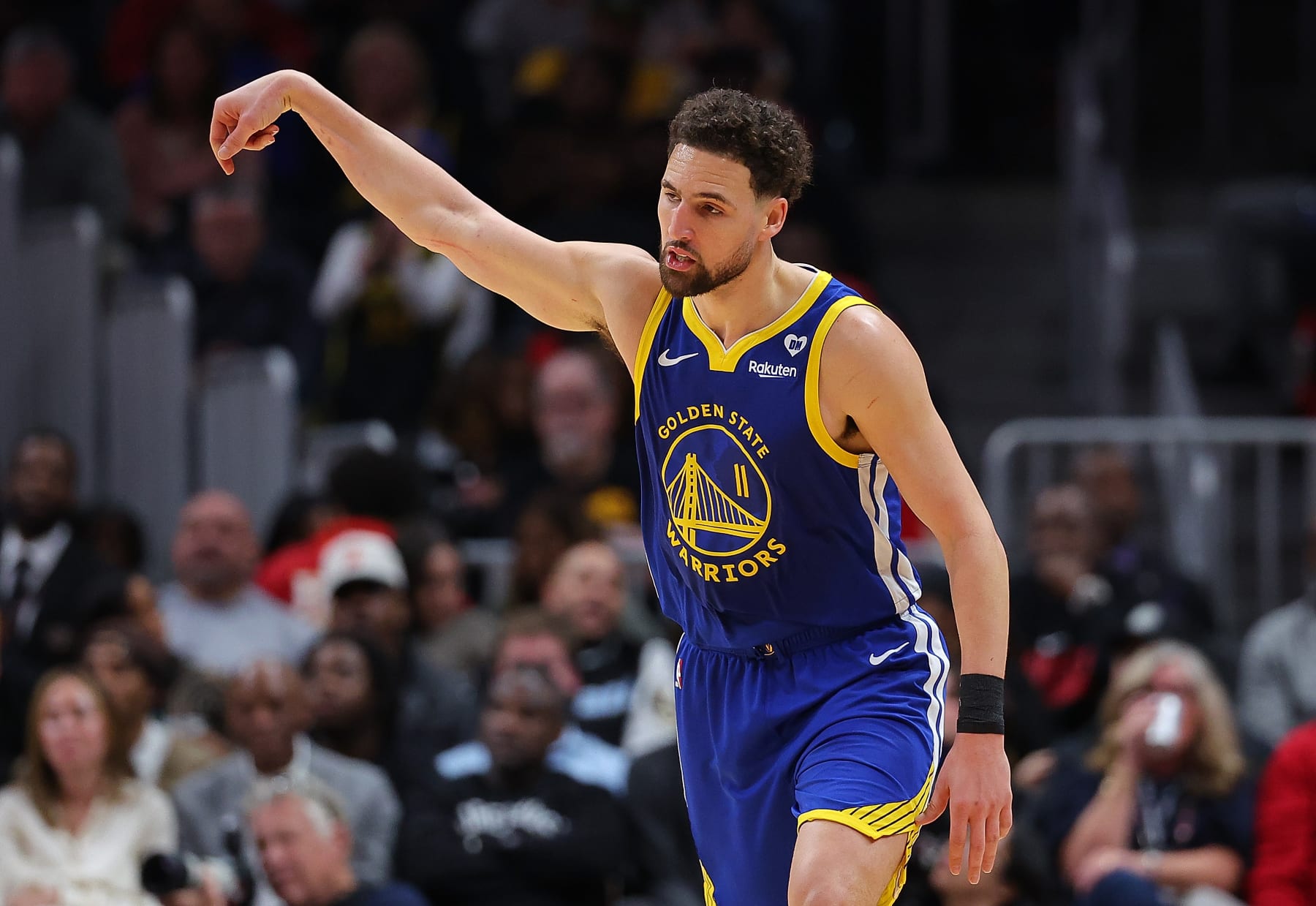 ATLANTA, GEORGIA - FEBRUARY 03:  Klay Thompson #11 of the Golden State Warriors reacts after hitting a three-point basket against the Atlanta Hawks during the second quarter at State Farm Arena on February 03, 2024 in Atlanta, Georgia.  NOTE TO USER: User expressly acknowledges and agrees that, by downloading and/or using this photograph, user is consenting to the terms and conditions of the Getty Images License Agreement.  (Photo by Kevin C. Cox/Getty Images)