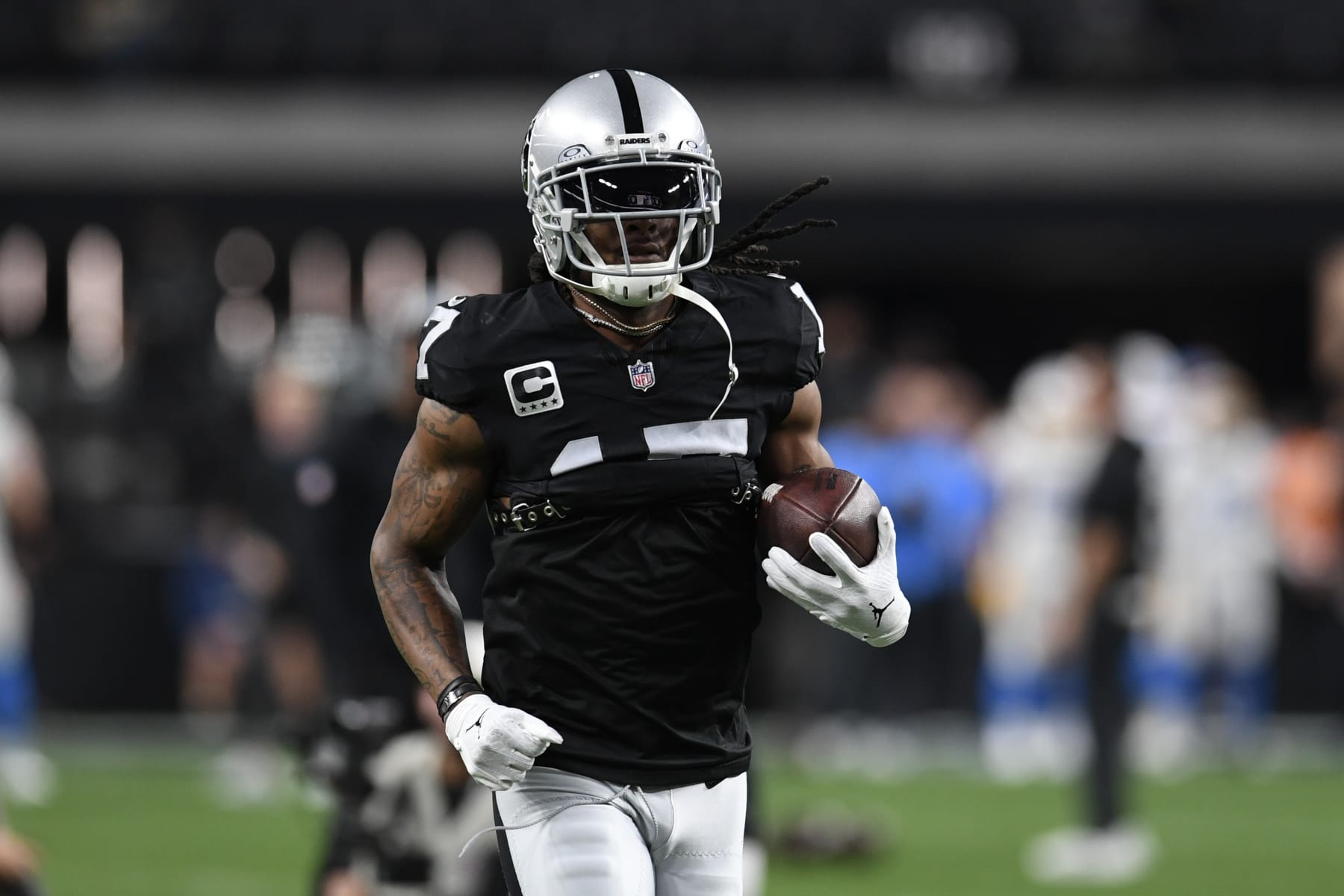LAS VEGAS, NEVADA - DECEMBER 14: Wide receiver Davante Adams #17 of the Las Vegas Raiders warms up against the Los Angeles Chargers at Allegiant Stadium on December 14, 2023 in Las Vegas, Nevada. The Raiders defeated the Chargers 63-21. (Photo by Candice Ward/Getty Images)