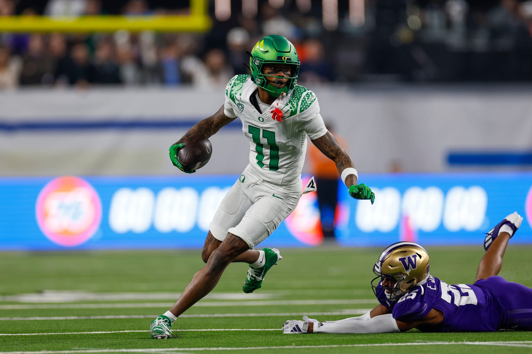 LAS VEGAS, NEVADA - DECEMBER 1: Troy Franklin #11 of the Oregon Ducks runs with the ball during the Pac-12 Championship game against the Washington Huskies at Allegiant Stadium on December 1, 2023 in Las Vegas, Nevada. (Photo by Brandon Sloter/Image Of Sport/Getty Images)