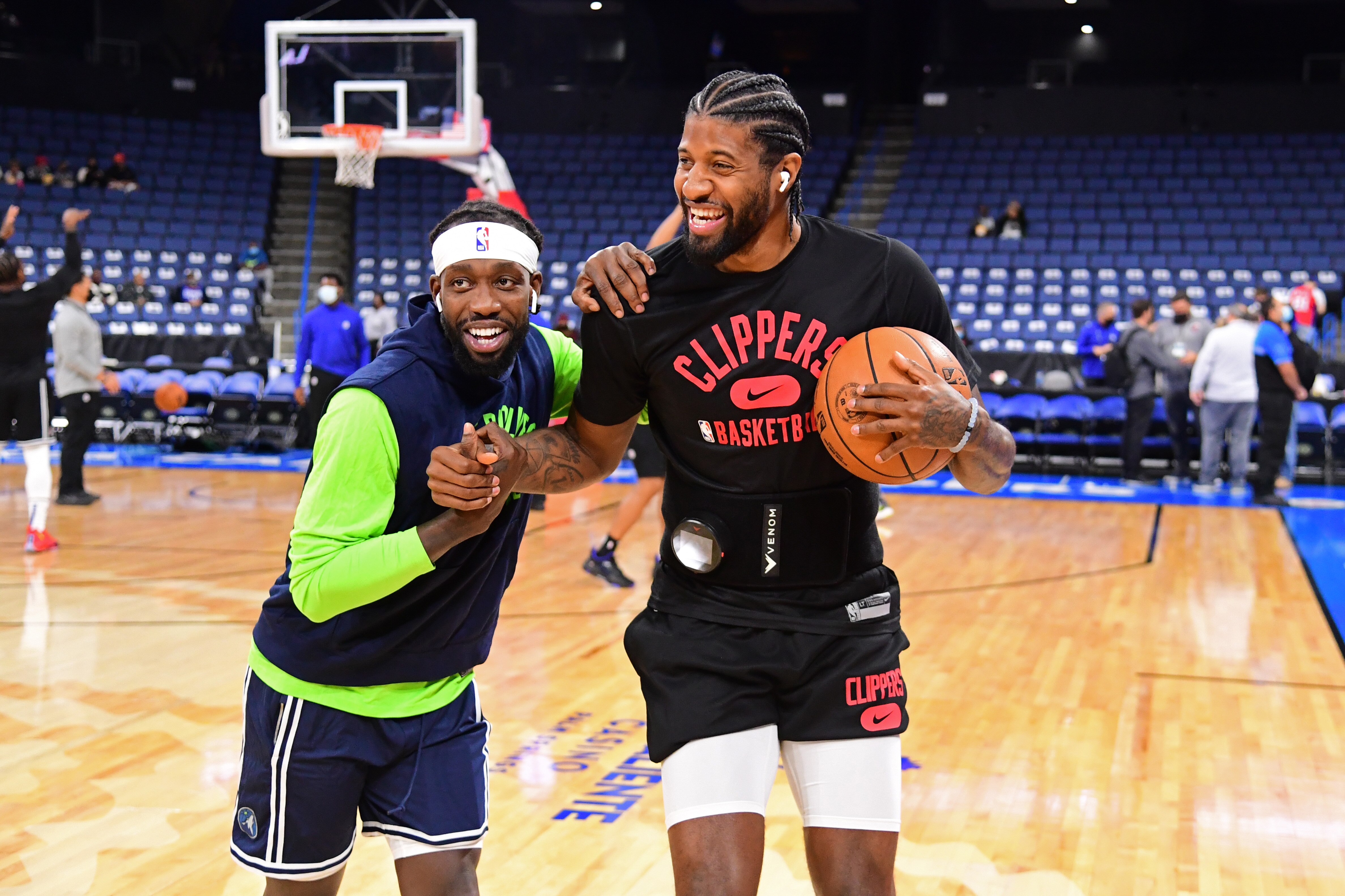 ONTARIO, CALIFORNIA - OCTOBER 11: Patrick Beverley #22 of the Minnesota Timberwolves and Paul George #13 of the LA Clippers embrace before the preseason game on October 11, 2021 at Toyota Arena in Ontario, CA. NOTE TO USER: User expressly acknowledges and agrees that, by downloading and/or using this Photograph, user is consenting to the terms and conditions of the Getty Images License Agreement. Mandatory Copyright Notice: Copyright 2021 NBAE (Photo by Adam Pantozzi/NBAE via Getty Images)