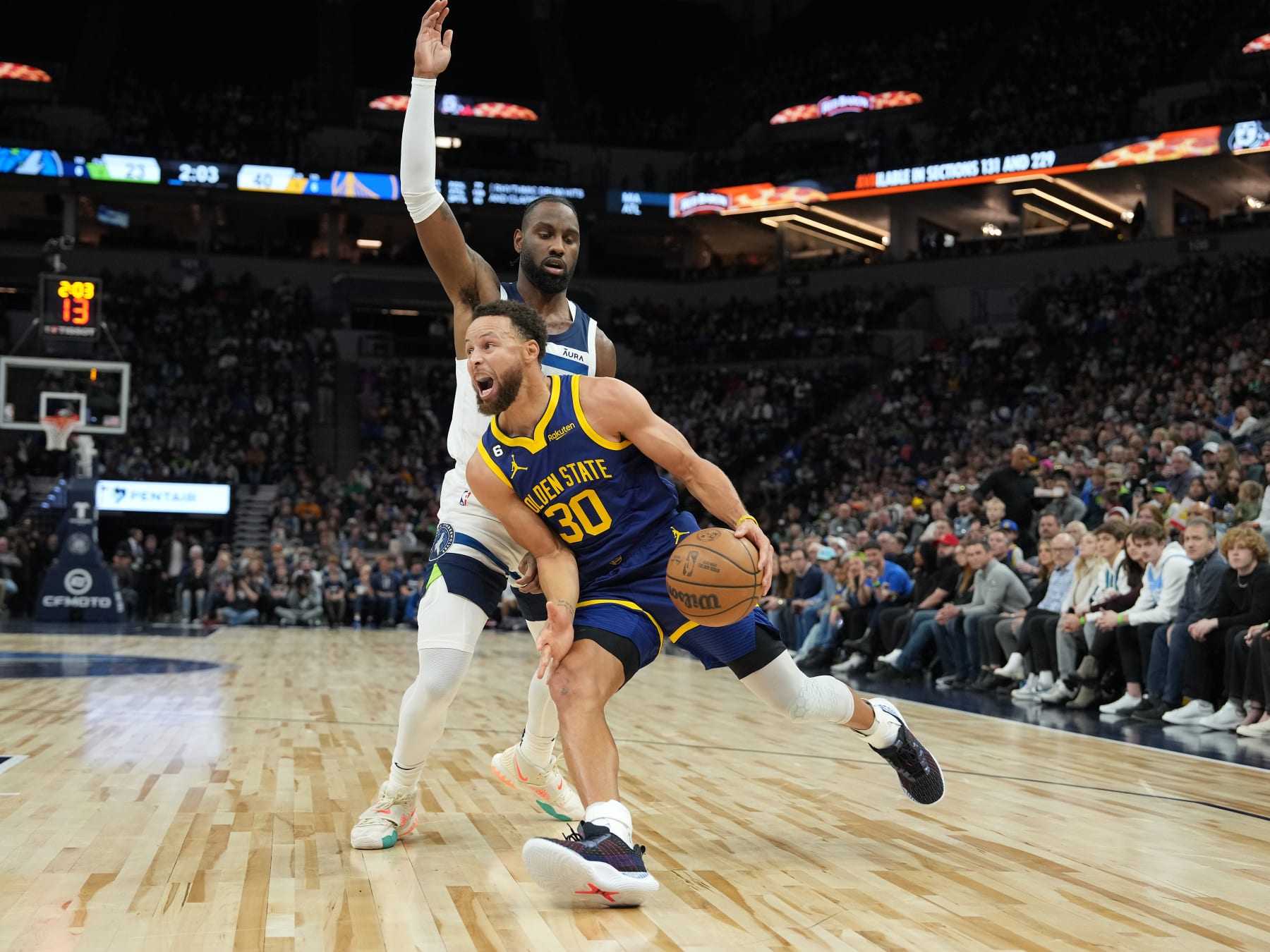 MINNEAPOLIS, MN -  NOVEMBER 27: Stephen Curry #30 of the Golden State Warriors drives to the basket against the Minnesota Timberwolves on November 27, 2022 at Target Center in Minneapolis, Minnesota. NOTE TO USER: User expressly acknowledges and agrees that, by downloading and or using this Photograph, user is consenting to the terms and conditions of the Getty Images License Agreement. Mandatory Copyright Notice: Copyright 2022 NBAE (Photo by Jordan JohnsonNBAE via Getty Images)