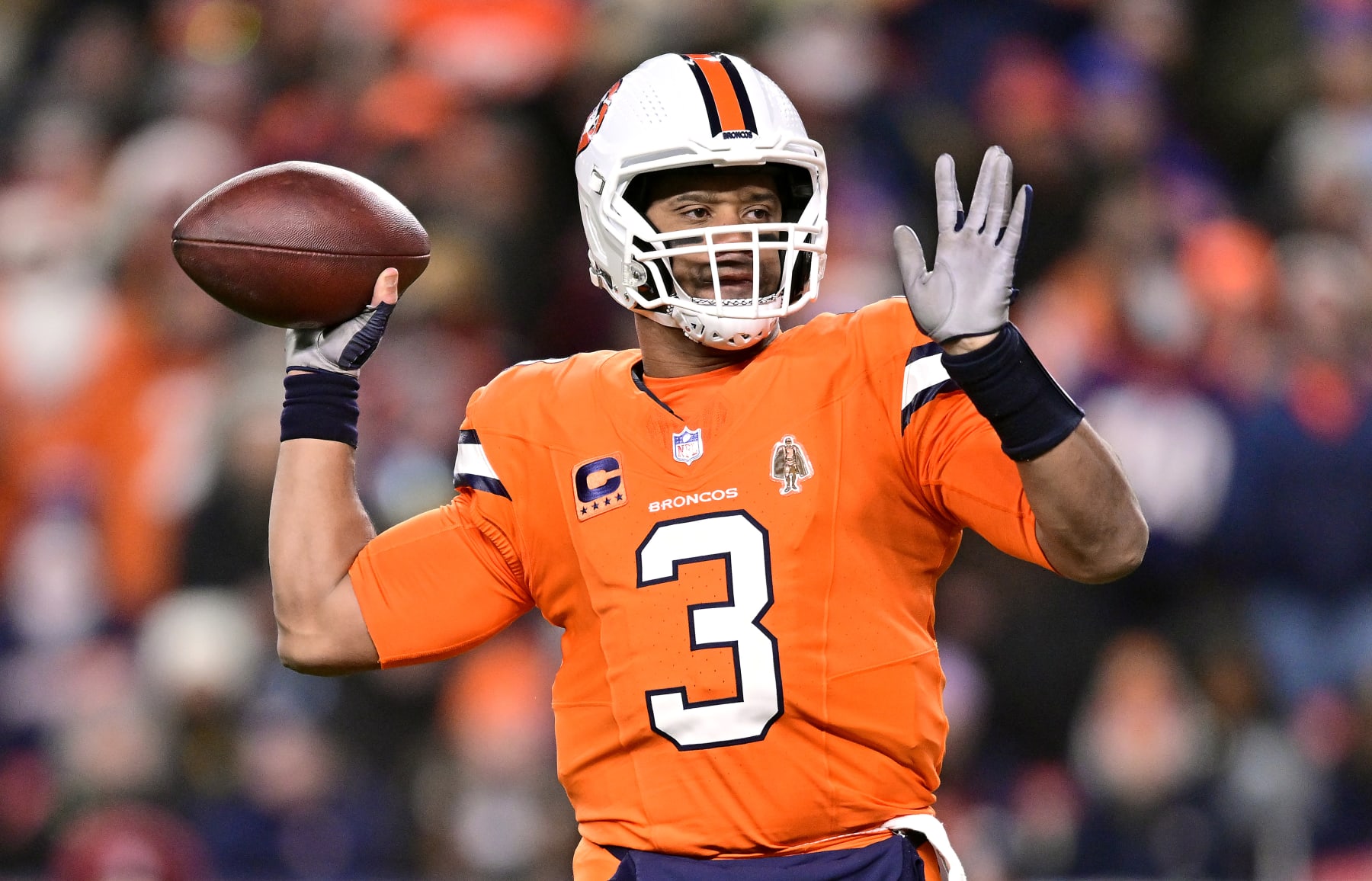 DENVER, COLORADO - DECEMBER 24:  Quarterback Russell Wilson #3 of the Denver Broncos passes during the 1st quarter of the game against the New England Patriots at Empower Field At Mile High on December 24, 2023 in Denver, Colorado. (Photo by Dustin Bradford/Getty Images)