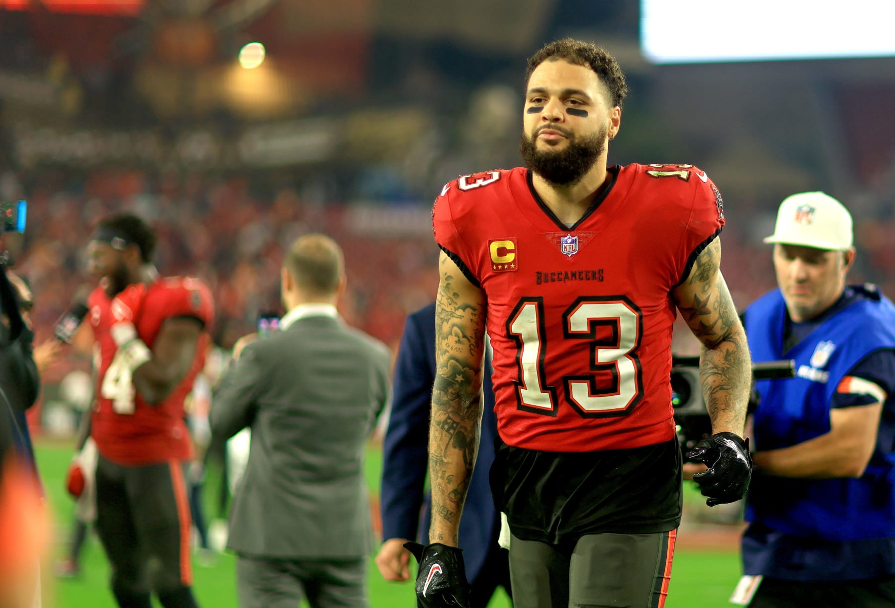 TAMPA, FLORIDA - JANUARY 15: Mike Evans #13 of the Tampa Bay Buccaneers looks on during the NFC Wild Card game against the Philadelphia Eagles at Raymond James Stadium on January 15, 2024 in Tampa, Florida. (Photo by Mike Ehrmann/Getty Images)