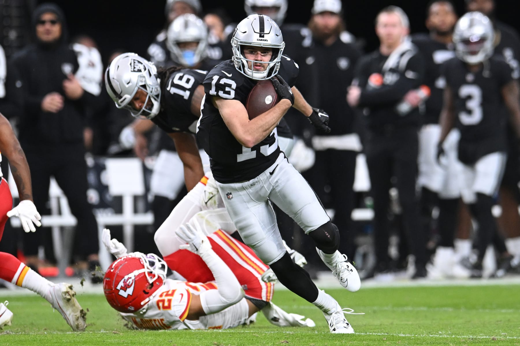 LAS VEGAS, NEVADA - NOVEMBER 26: Hunter Renfrow #13 of the Las Vegas Raiders runs with the ball during the first half of a game against the Kansas City Chiefs at Allegiant Stadium on November 26, 2023 in Las Vegas, Nevada. (Photo by Candice Ward/Getty Images)