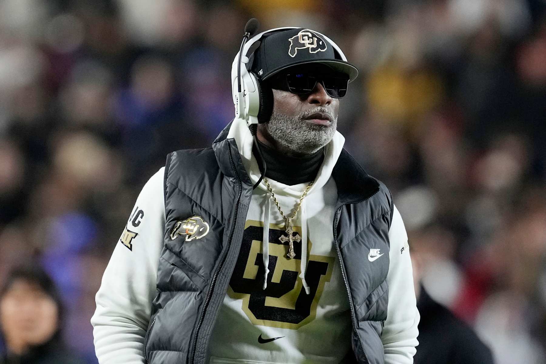 KANSAS CITY, MISSOURI - NOVEMBER 23: Head coach Deion Sanders of the Colorado Buffaloes walks the side line in the second half against the Kansas Jayhawks at Arrowhead Stadium on November 23, 2024 in Kansas City, Missouri.  (Photo by Ed Zurga/Getty Images)