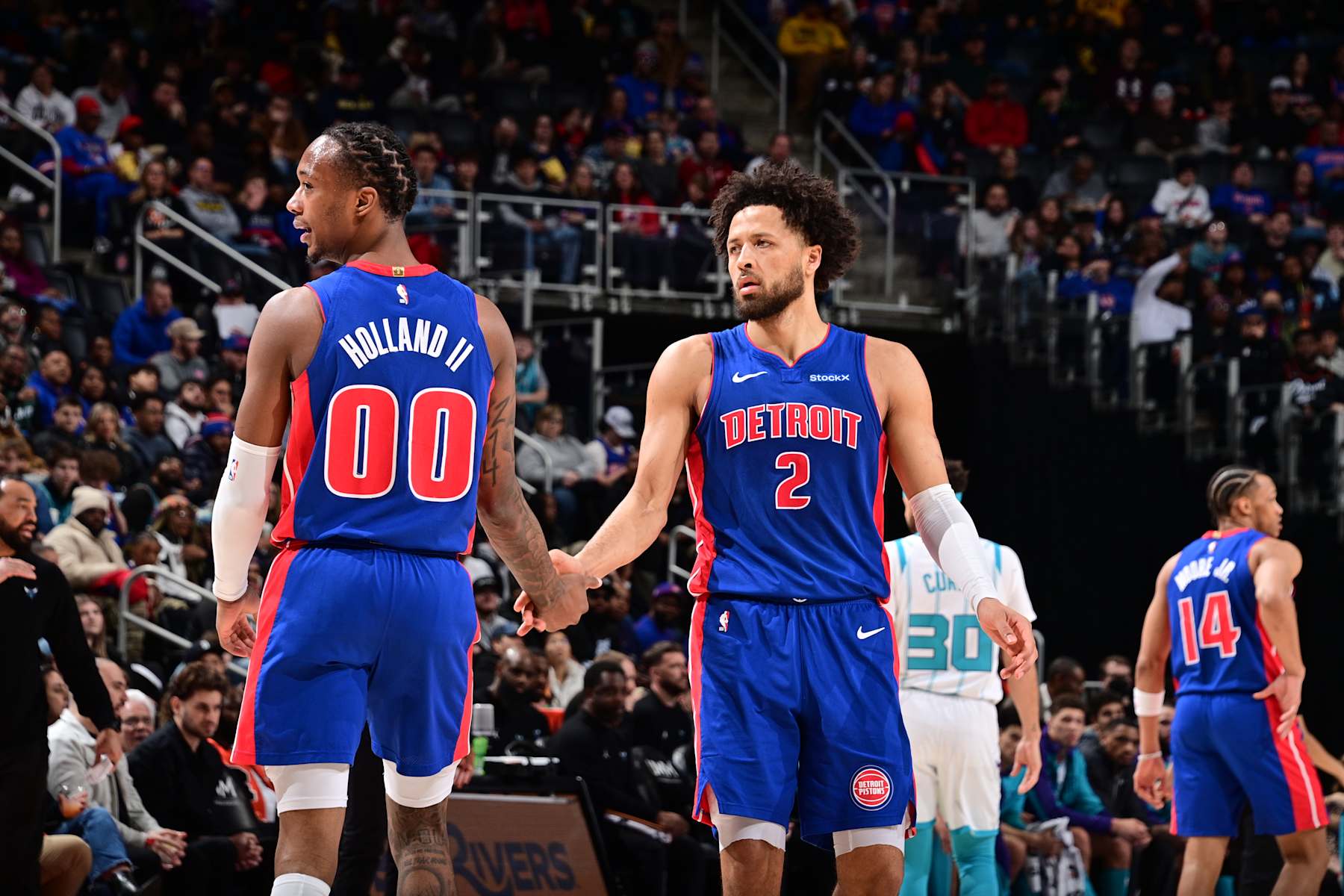 DETROIT, MI - JANUARY 3: Ron Holland II #00 and Cade Cunningham #2 of the Detroit Pistons high five during the game against the Charlotte Hornets on January 3, 2025 at Little Caesars Arena in Detroit, Michigan. NOTE TO USER: User expressly acknowledges and agrees that, by downloading and/or using this photograph, User is consenting to the terms and conditions of the Getty Images License Agreement. Mandatory Copyright Notice: Copyright 2025 NBAE (Photo by Chris Schwegler/NBAE via Getty Images)