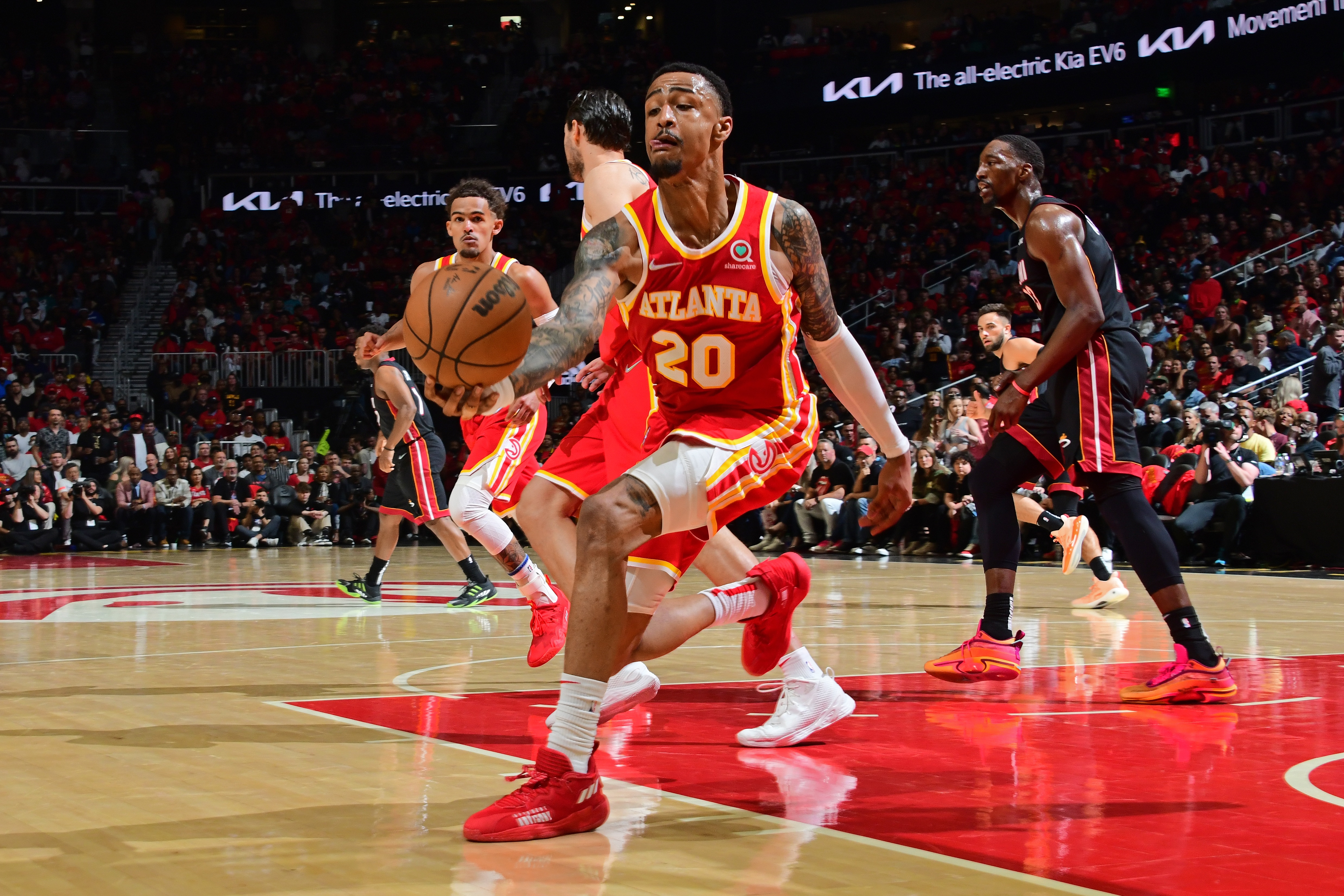 ATLANTA, GA - APRIL 22: John Collins #20 of the Atlanta Hawks handles the ball during the game against the Miami Heat during Round 1 Game 3 of the NBA Playoffs on April 22, 2022 at State Farm Arena in Atlanta, Georgia.  NOTE TO USER: User expressly acknowledges and agrees that, by downloading and/or using this Photograph, user is consenting to the terms and conditions of the Getty Images License Agreement. Mandatory Copyright Notice: Copyright 2022 NBAE (Photo by Scott Cunningham/NBAE via Getty Images)