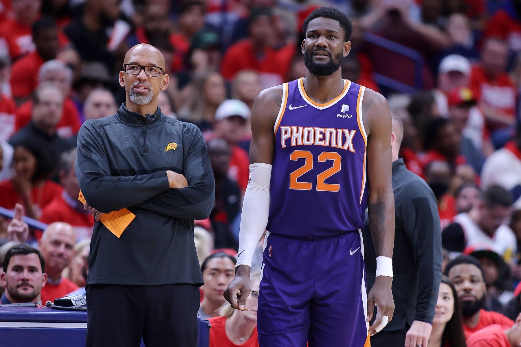 NEW ORLEANS, LOUISIANA - APRIL 24: Deandre Ayton #22 and Head coach Monty Williams of the Phoenix Suns react during Game Four of the Western Conference First Round NBA Playoffs against the New Orleans Pelicans at the Smoothie King Center on April 24, 2022 in New Orleans, Louisiana. NOTE TO USER: User expressly acknowledges and agrees that, by downloading and or using this Photograph, user is consenting to the terms and conditions of the Getty Images License Agreement. (Photo by Jonathan Bachman/Getty Images)