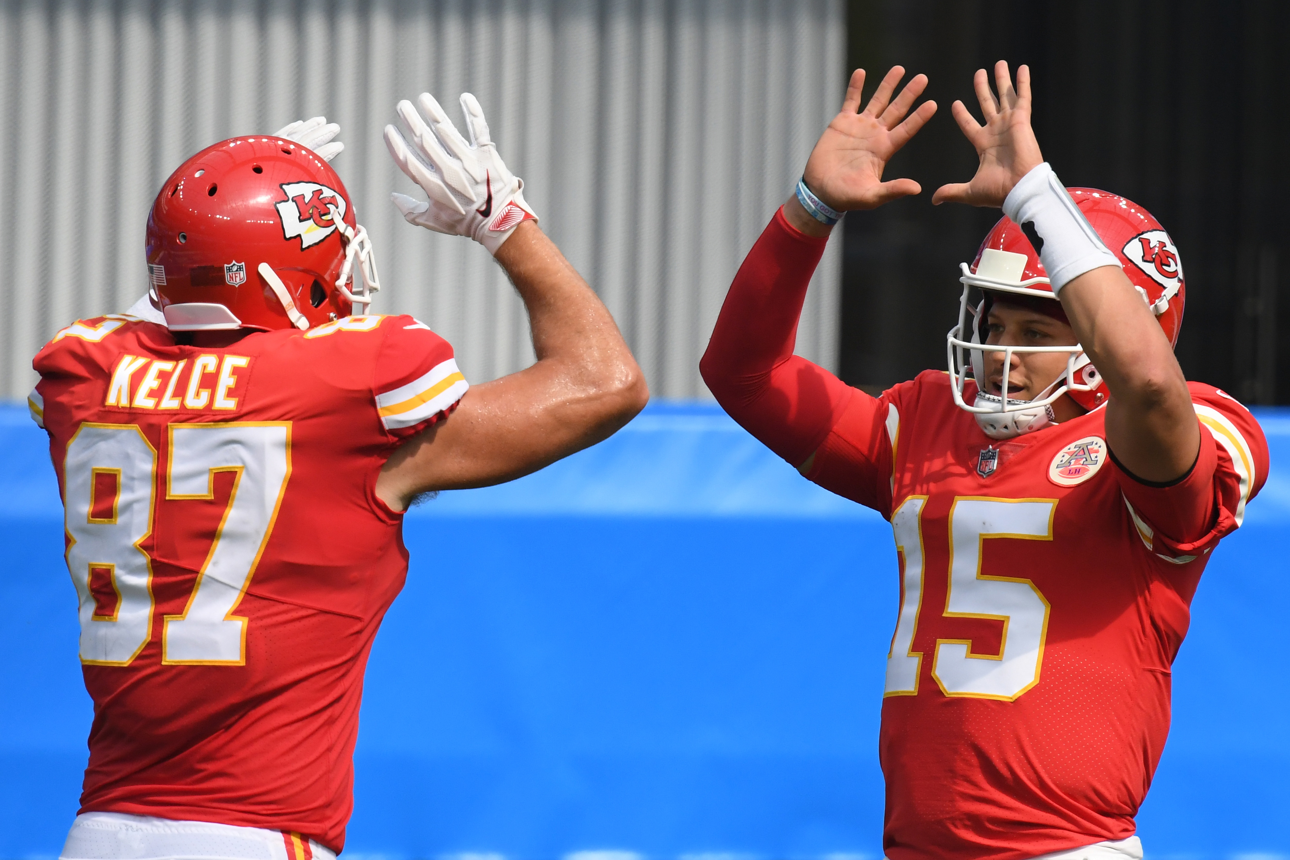 INGLEWOOD, CALIFORNIA - SEPTEMBER 20: Quarterback Patrick Mahomes #15 of the Kansas City Chiefs celebrates a touchdown by  teammate tight end Travis Kelce #87 against the Los Angeles Chargers during the second quarter at SoFi Stadium on September 20, 2020 in Inglewood, California. (Photo by Harry How/Getty Images)