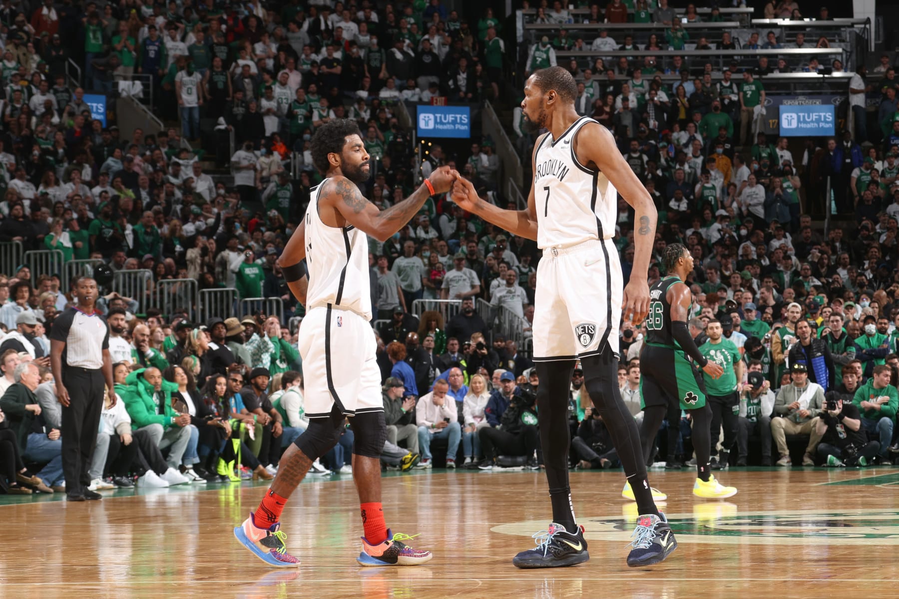 BOSTON, MA - APRIL 17: Kyrie Irving #11 of the Brooklyn Nets high fives Kevin Durant #7 against the Boston Celtics during Round 1 Game 1 of the 2022 NBA Playoffs on April 17, 2022 at the TD Garden in Boston, Massachusetts.  NOTE TO USER: User expressly acknowledges and agrees that, by downloading and or using this photograph, User is consenting to the terms and conditions of the Getty Images License Agreement. Mandatory Copyright Notice: Copyright 2022 NBAE  (Photo by Nathaniel S. Butler/NBAE via Getty Images)