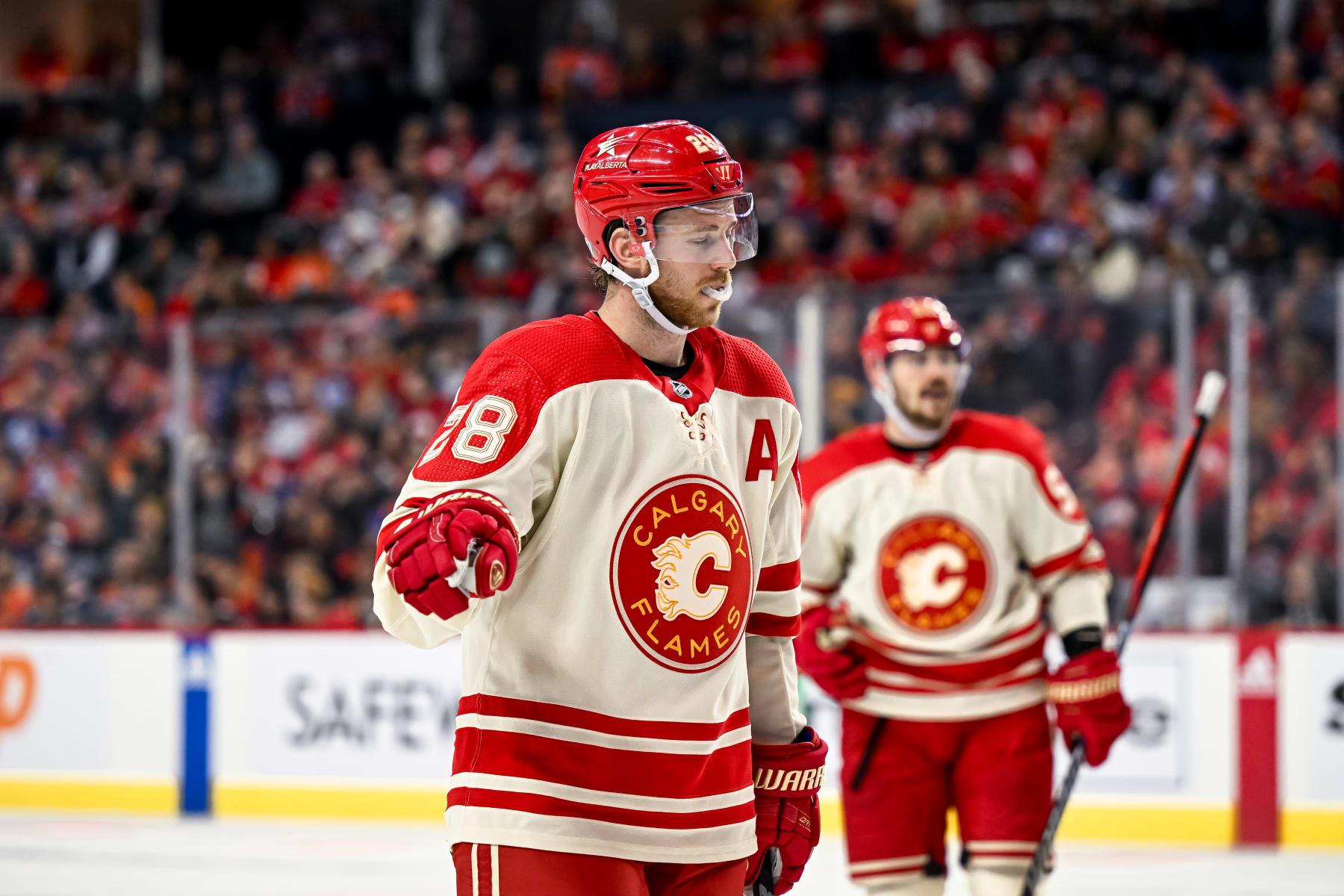 CALGARY, AB - JANUARY 20: Calgary Flames Center Elias Lindholm (28) gestures before a face-off during the third period of an NHL game between the Calgary Flames and the Edmonton Oilers on January 20, 2024, at the Scotiabank Saddledome in Calgary, AB. (Photo by Brett Holmes/Icon Sportswire via Getty Images)