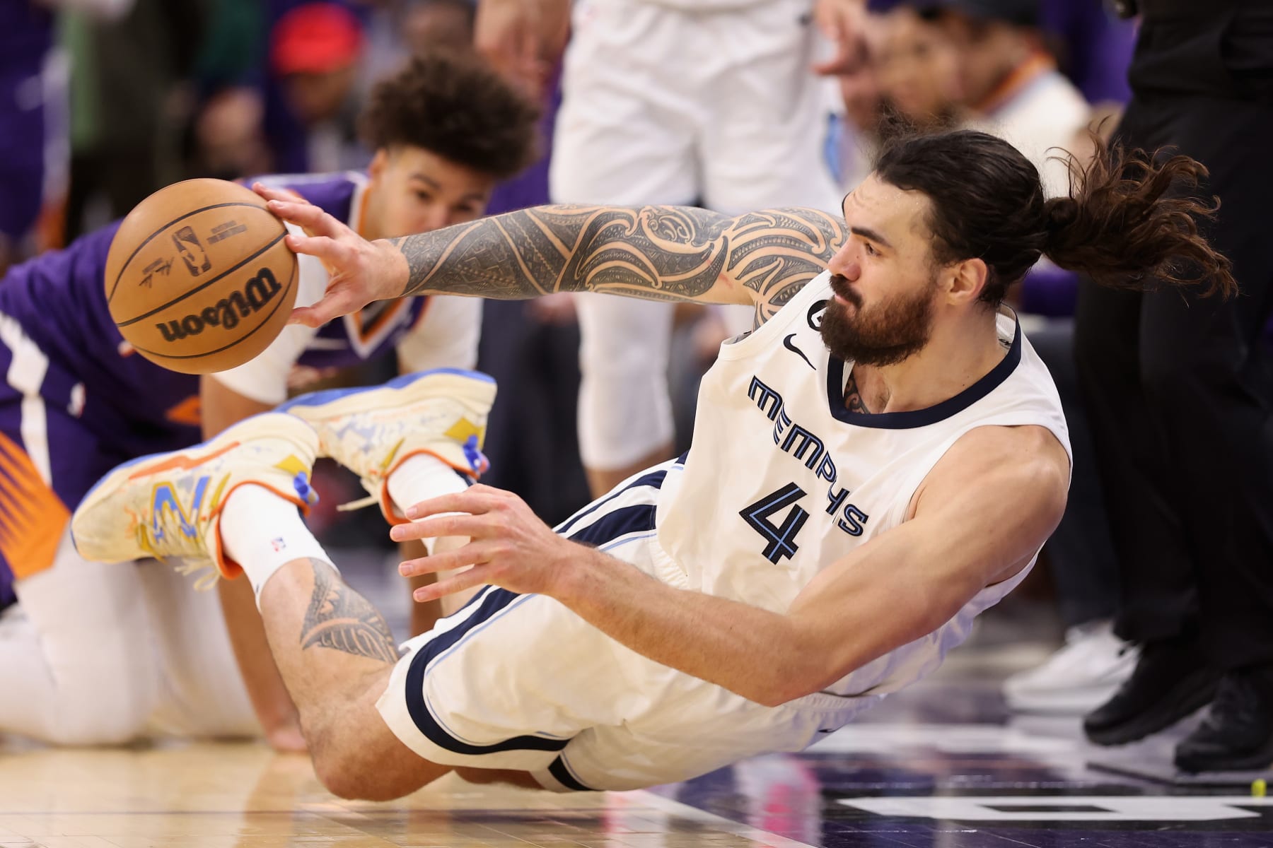 PHOENIX, ARIZONA - JANUARY 22: Steven Adams #4 of the Memphis Grizzlies saves an out-of-bounds ball during the second half of the NBA game against the Phoenix Suns at Footprint Center on January 22, 2023 in Phoenix, Arizona.  The Suns defeated the Grizzlies 112-110. NOTE TO USER: User expressly acknowledges and agrees that, by downloading and or using this photograph, User is consenting to the terms and conditions of the Getty Images License Agreement. (Photo by Christian Petersen/Getty Images)