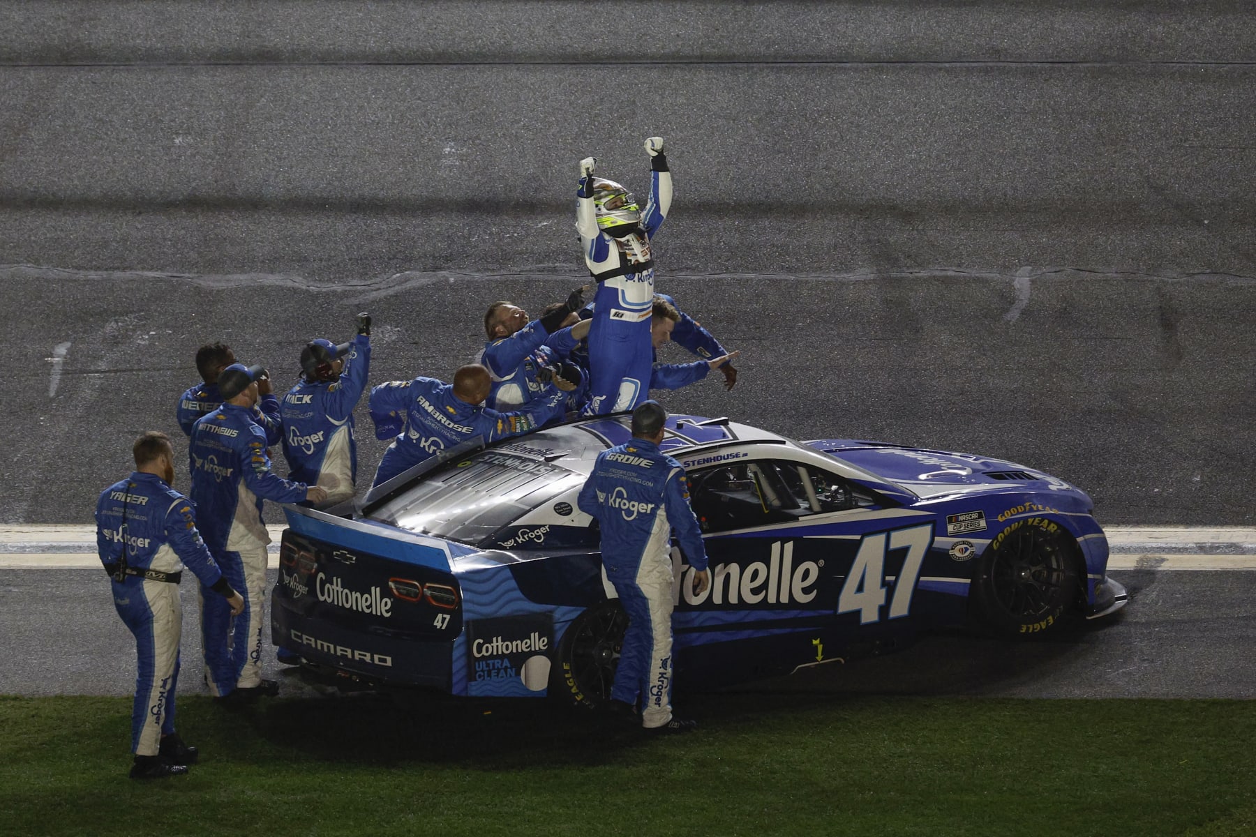 DAYTONA BEACH, FLORIDA - FEBRUARY 19: Ricky Stenhouse Jr., driver of the #47 Kroger/Cottonelle Chevrolet, celebrates with his crew after winning the NASCAR Cup Series 65th Annual Daytona 500 at Daytona International Speedway on February 19, 2023 in Daytona Beach, Florida. (Photo by Jared C. Tilton/Getty Images)