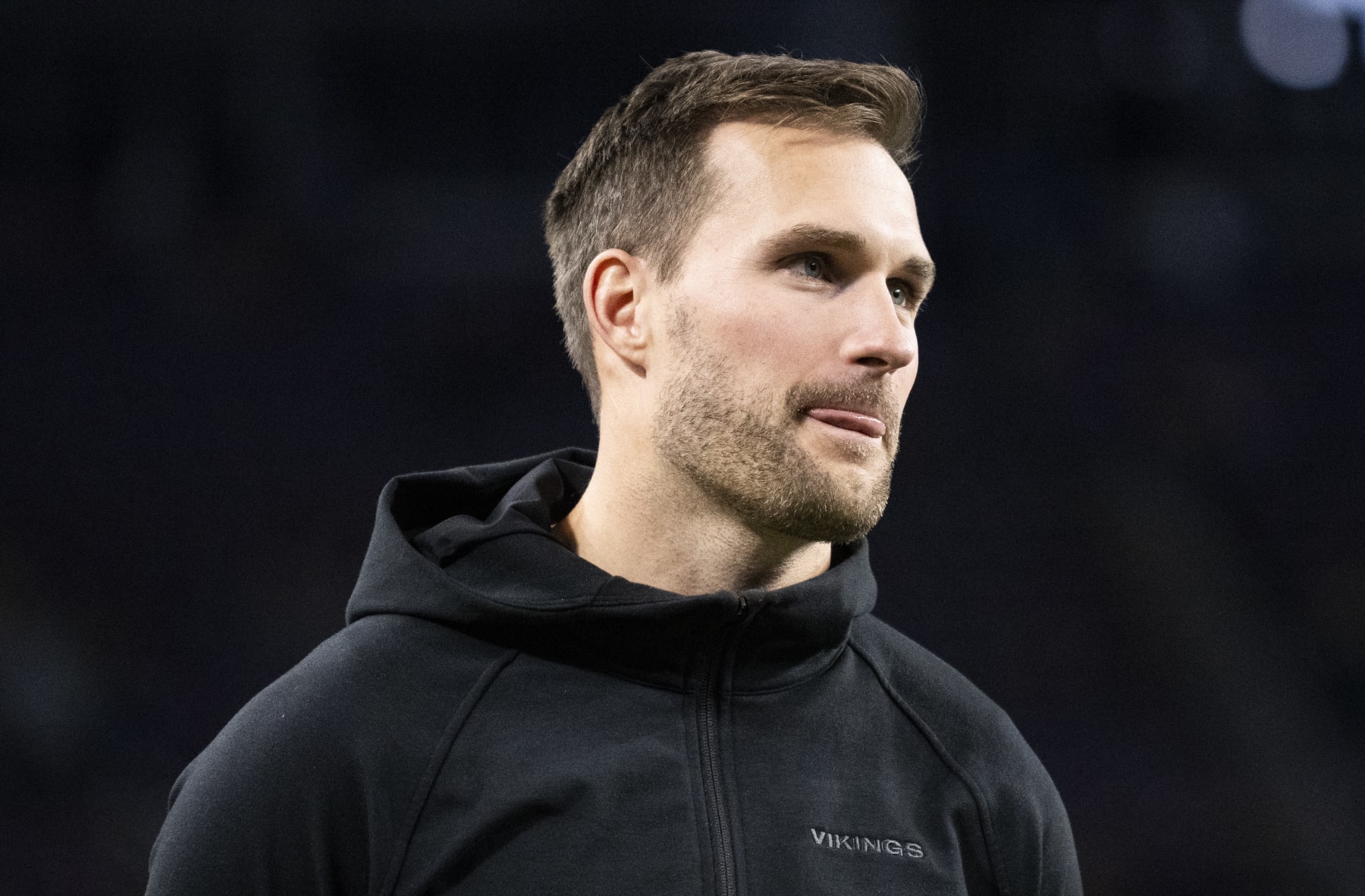MINNEAPOLIS, MINNESOTA - DECEMBER 31: Kirk Cousins #8 of the Minnesota Vikings looks on from the sidelines before the game against the Green Bay Packers at U.S. Bank Stadium on December 31, 2023 in Minneapolis, Minnesota. (Photo by Stephen Maturen/Getty Images)