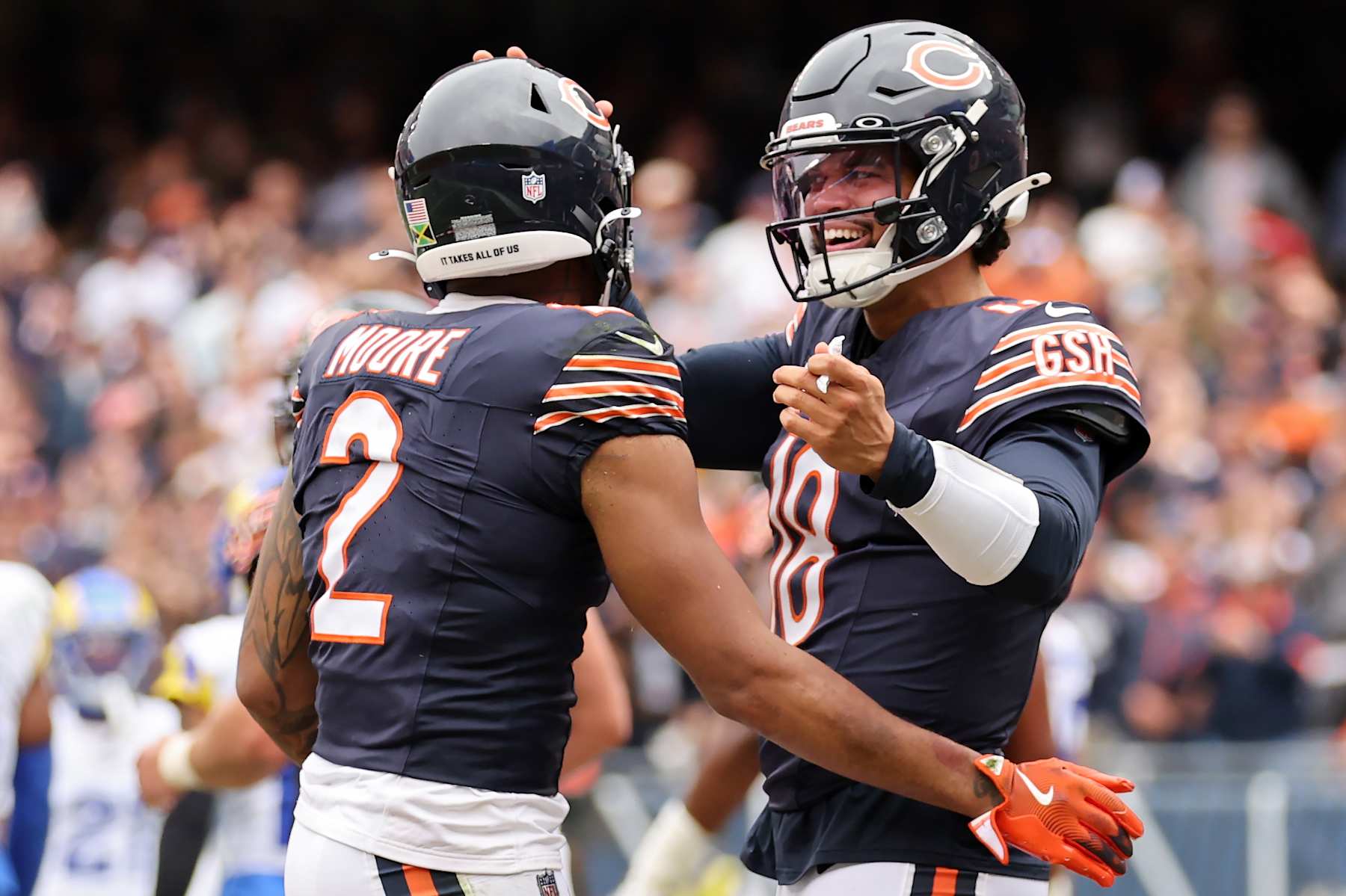 CHICAGO, ILLINOIS - SEPTEMBER 29: DJ Moore #2 and Caleb Williams #18 of the Chicago Bears celebrate after their touchdown connection against the Los Angeles Rams during the third quarter at Soldier Field on September 29, 2024 in Chicago, Illinois. (Photo by Michael Reaves/Getty Images) CHICAGO, ILLINOIS - SEPTEMBER 29: DJ Moore #2 and Caleb Williams #18 of the Chicago Bears celebrate after their touchdown connection against the Los Angeles Rams during the third quarter at Soldier Field on September 29, 2024 in Chicago, Illinois. (Photo by Michael Reaves/Getty Images)
