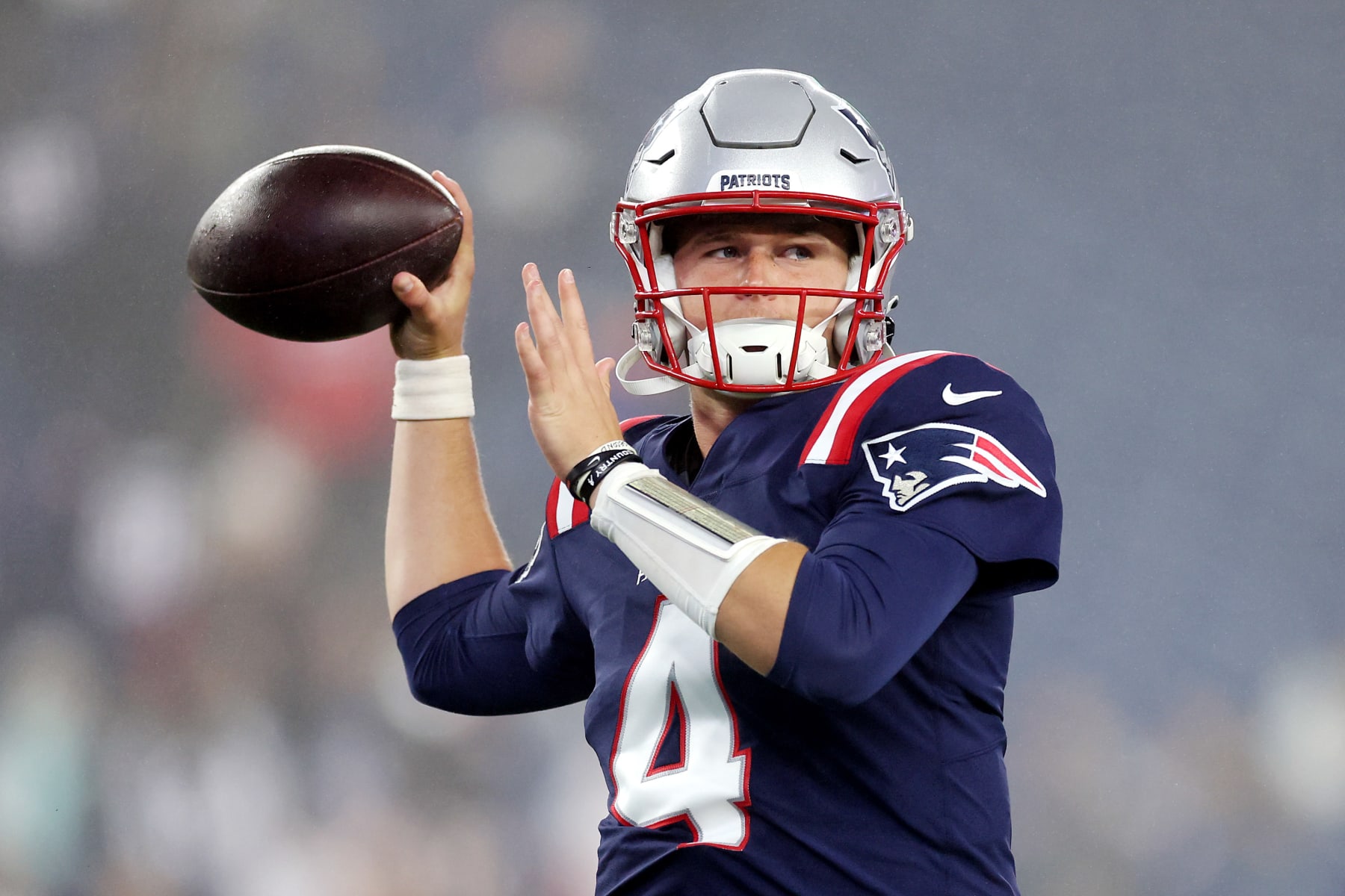 FOXBOROUGH, MASSACHUSETTS - OCTOBER 24: Bailey Zappe #4 of the New England Patriots warms up before the game against the Chicago Bears at Gillette Stadium on October 24, 2022 in Foxborough, Massachusetts. (Photo by Maddie Meyer/Getty Images)