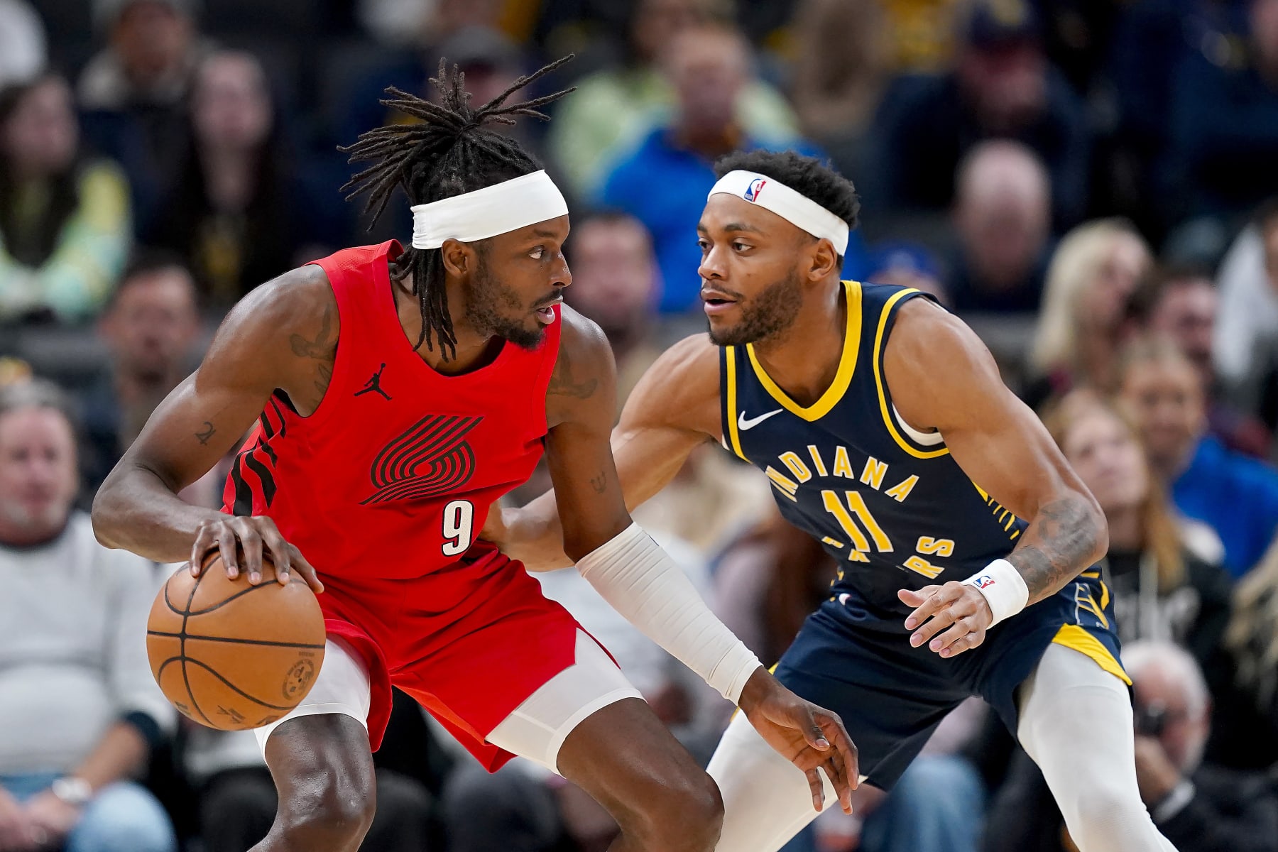INDIANAPOLIS, INDIANA - NOVEMBER 27: Jerami Grant #9 of the Portland Trail Blazers dribbles the ball against Bruce Brown #11 of the Indiana Pacers in the fourth quarter at Gainbridge Fieldhouse on November 27, 2023 in Indianapolis, Indiana. NOTE TO USER: User expressly acknowledges and agrees that, by downloading and or using this photograph, User is consenting to the terms and conditions of the Getty Images License Agreement. (Photo by Dylan Buell/Getty Images)