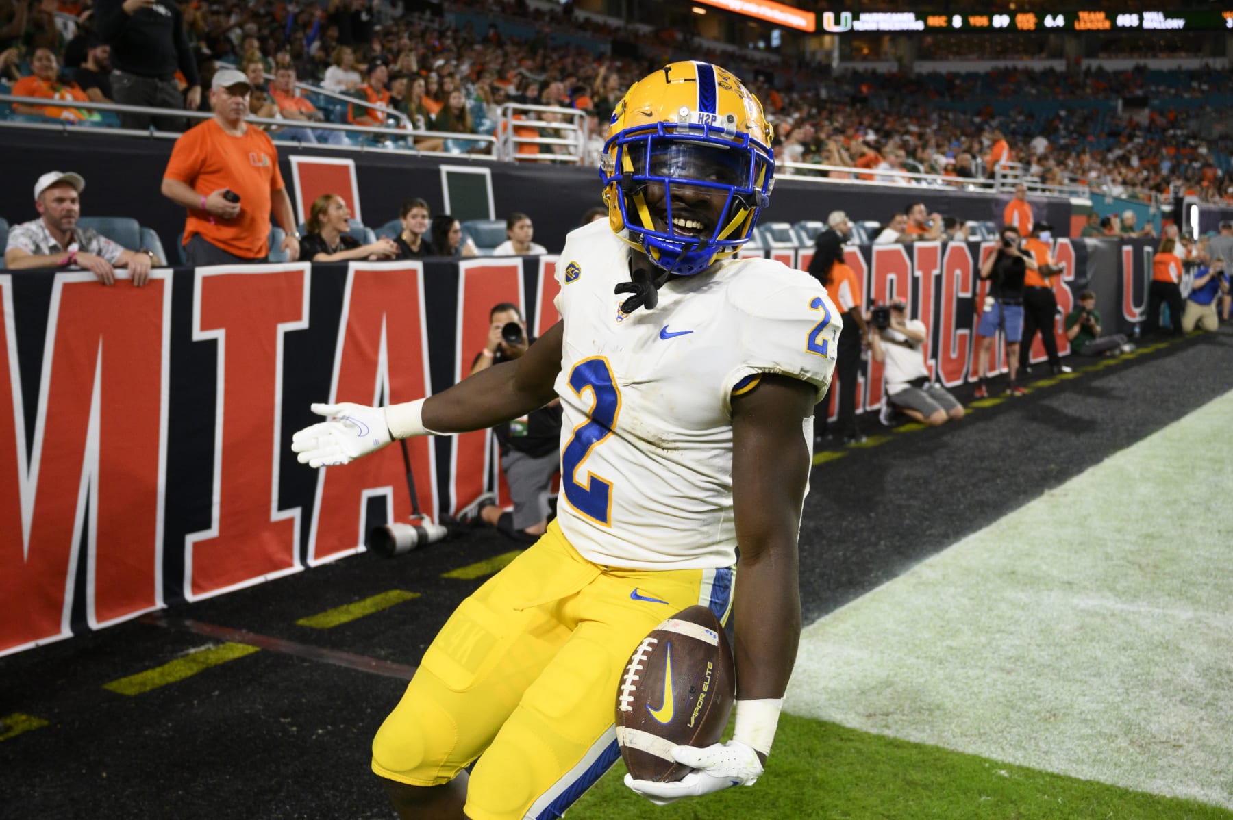 MIAMI GARDENS, FL - NOVEMBER 26: Pittsburgh running back Israel Abanikanda (2) smiles as he celebrates scoring  touchdown during an college football game between the Pittsburgh Panthers and the University of Miami Hurricanes on November 26, 2022 at the Hard Rock Stadium in Miami Gardens, FL. (Photo by Doug Murray/Icon Sportswire via Getty Images)