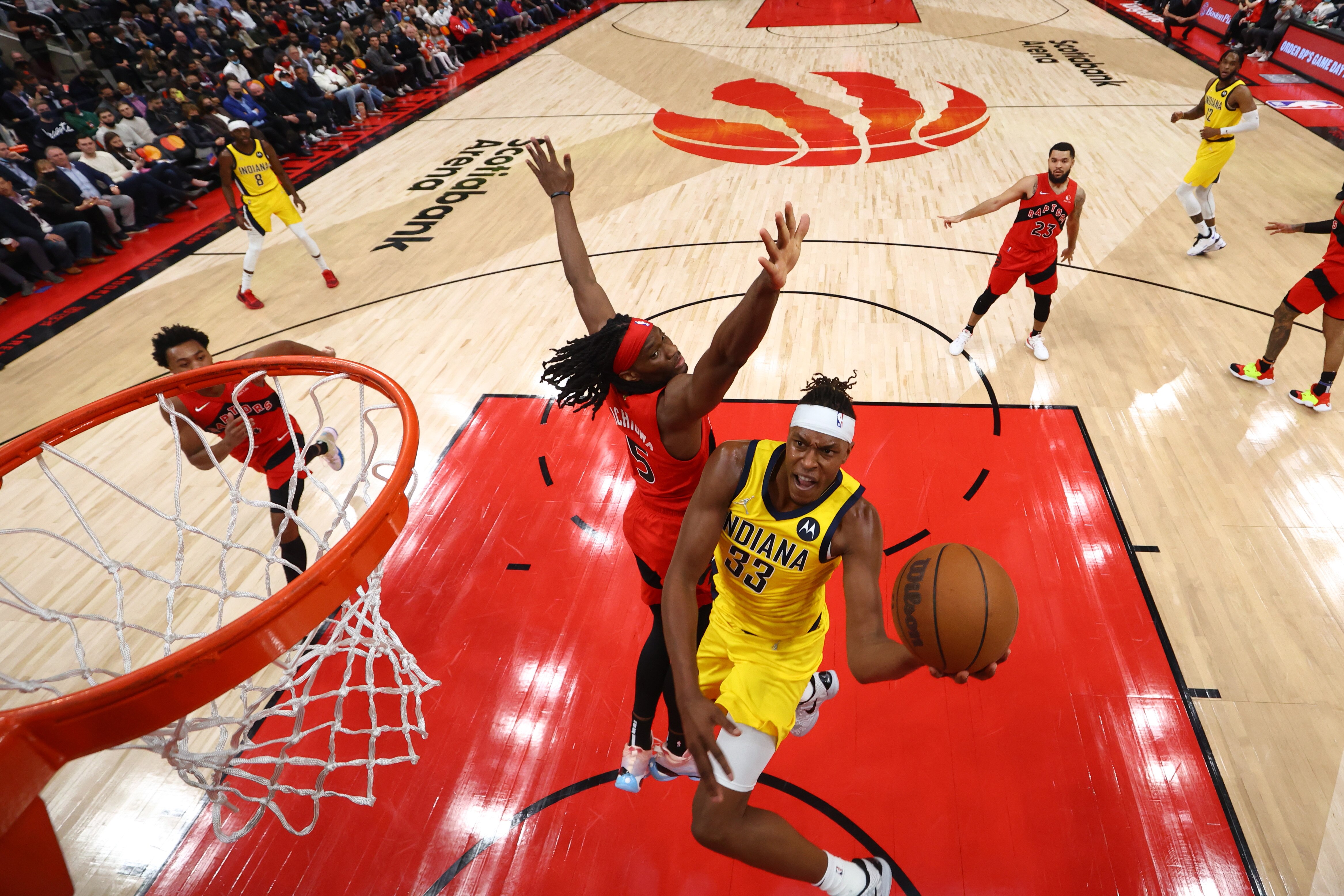 TORONTO, CANADA - OCTOBER 27: Myles Turner #33 of the Indiana Pacers drives to the basket against the Toronto Raptors on October 27, 2021 at the Scotiabank Arena in Toronto, Ontario, Canada.  NOTE TO USER: User expressly acknowledges and agrees that, by downloading and or using this Photograph, user is consenting to the terms and conditions of the Getty Images License Agreement.  Mandatory Copyright Notice: Copyright 2021 NBAE (Photo by Vaughn Ridley/NBAE via Getty Images)