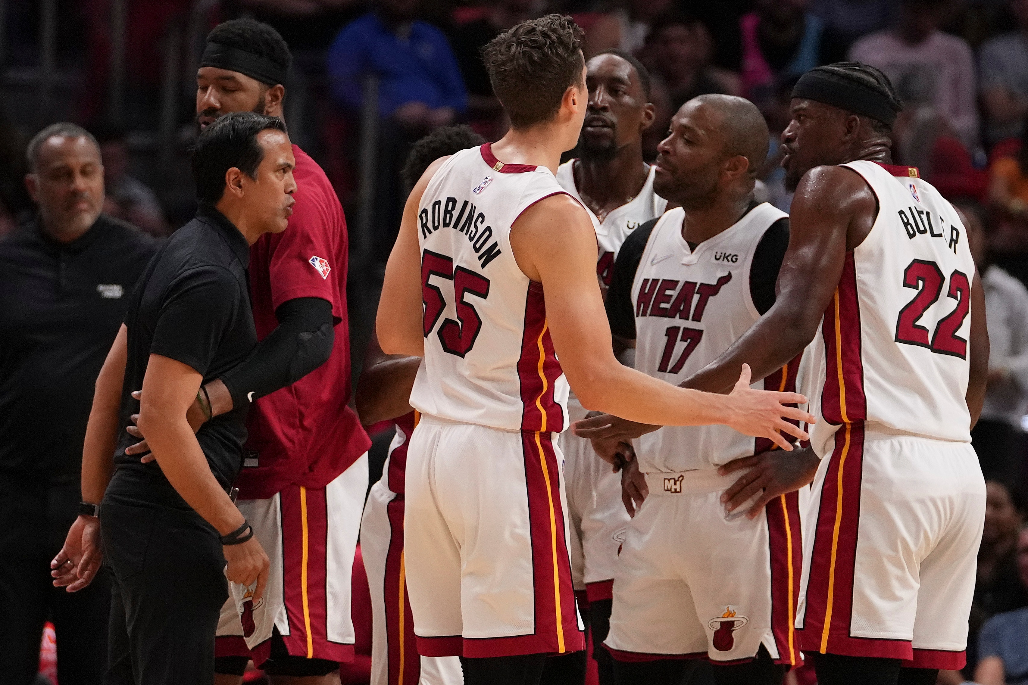 MIAMI, FLORIDA - MARCH 23: Head coach Erik Spoelstra of the Miami Heat yells at Jimmy Butler #22 during a timeout in the second half against the Golden State Warriors at FTX Arena on March 23, 2022 in Miami, Florida. NOTE TO USER: User expressly acknowledges and agrees that, by downloading and or using this photograph, User is consenting to the terms and conditions of the Getty Images License Agreement.  (Photo by Eric Espada/Getty Images)