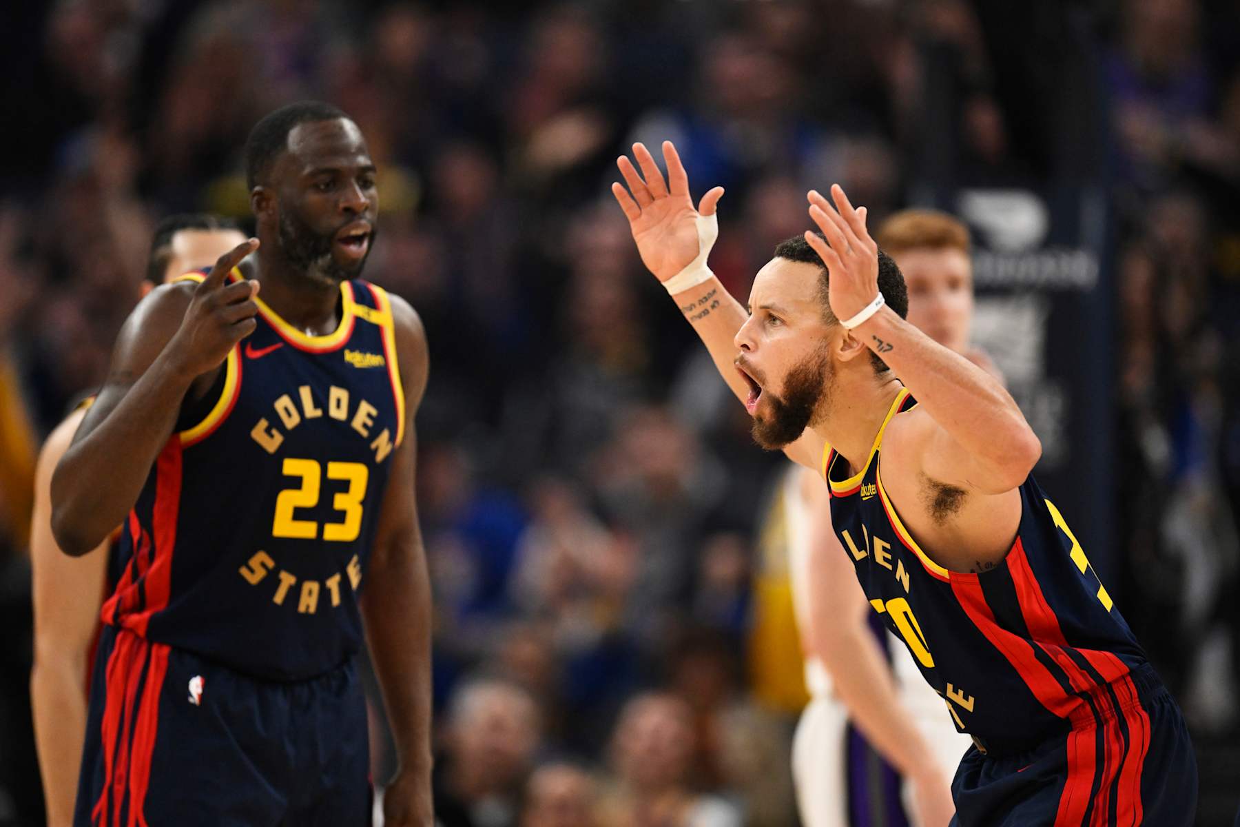 SAN FRANCISCO, CALIFORNIA - JANUARY 05: Stephen Curry #30 of the Golden State Warriors and Draymond Green #23 celebrate Curry's three point basket and foul against the Sacramento Kings in the second quarter at Chase Center on January 05, 2025 in San Francisco, California. NOTE TO USER: User expressly acknowledges and agrees that, by downloading and or using this photograph, User is consenting to the terms and conditions of the Getty Images License Agreement. (Photo by Eakin Howard/Getty Images)