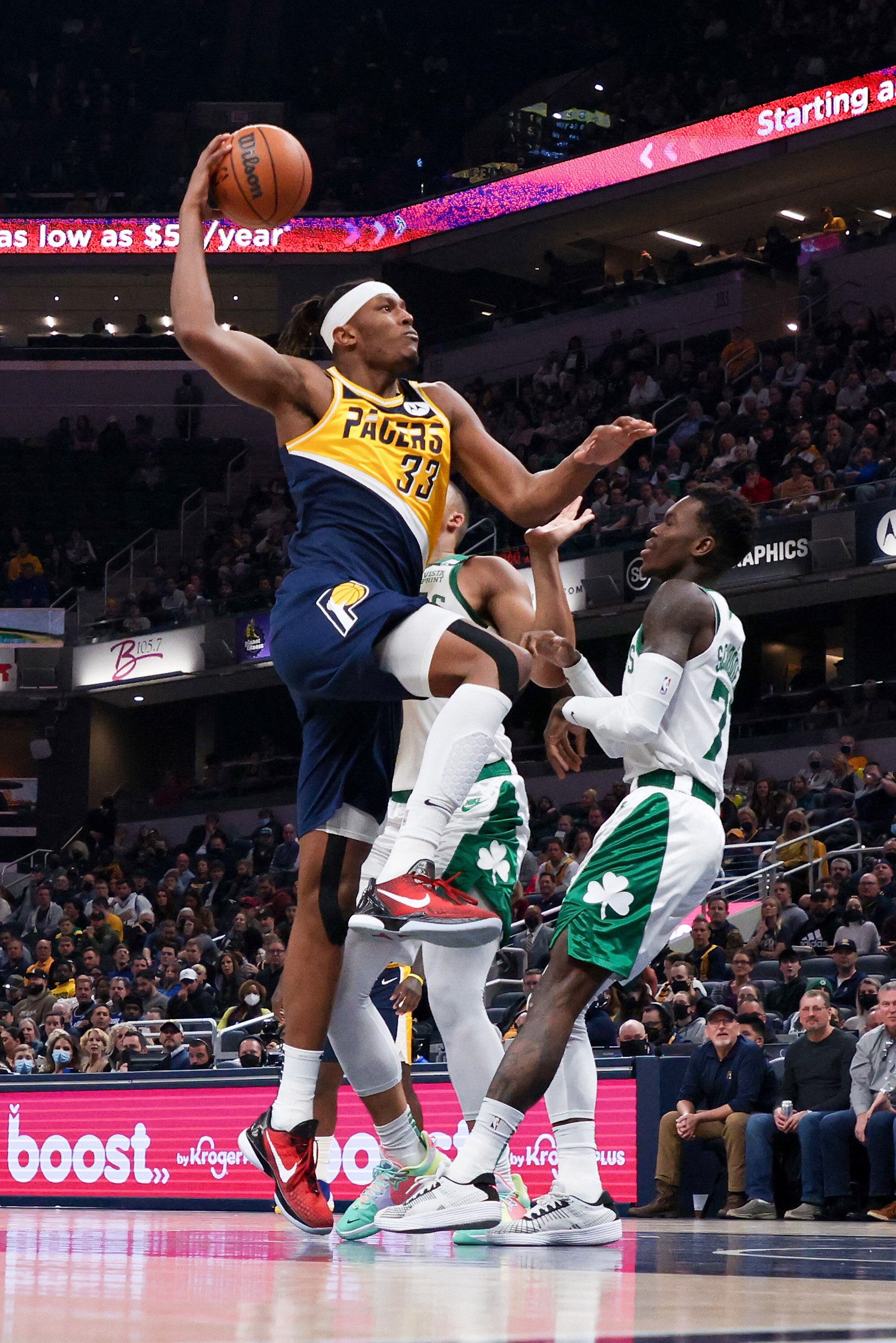 INDIANAPOLIS, INDIANA - JANUARY 12: Myles Turner #33 of the Indiana Pacers attempts a shot while being guarded by Dennis Schroder #71 of the Boston Celtics in the second quarter at Gainbridge Fieldhouse on January 12, 2022 in Indianapolis, Indiana. NOTE TO USER: User expressly acknowledges and agrees that, by downloading and or using this Photograph, user is consenting to the terms and conditions of the Getty Images License Agreement. (Photo by Dylan Buell/Getty Images)