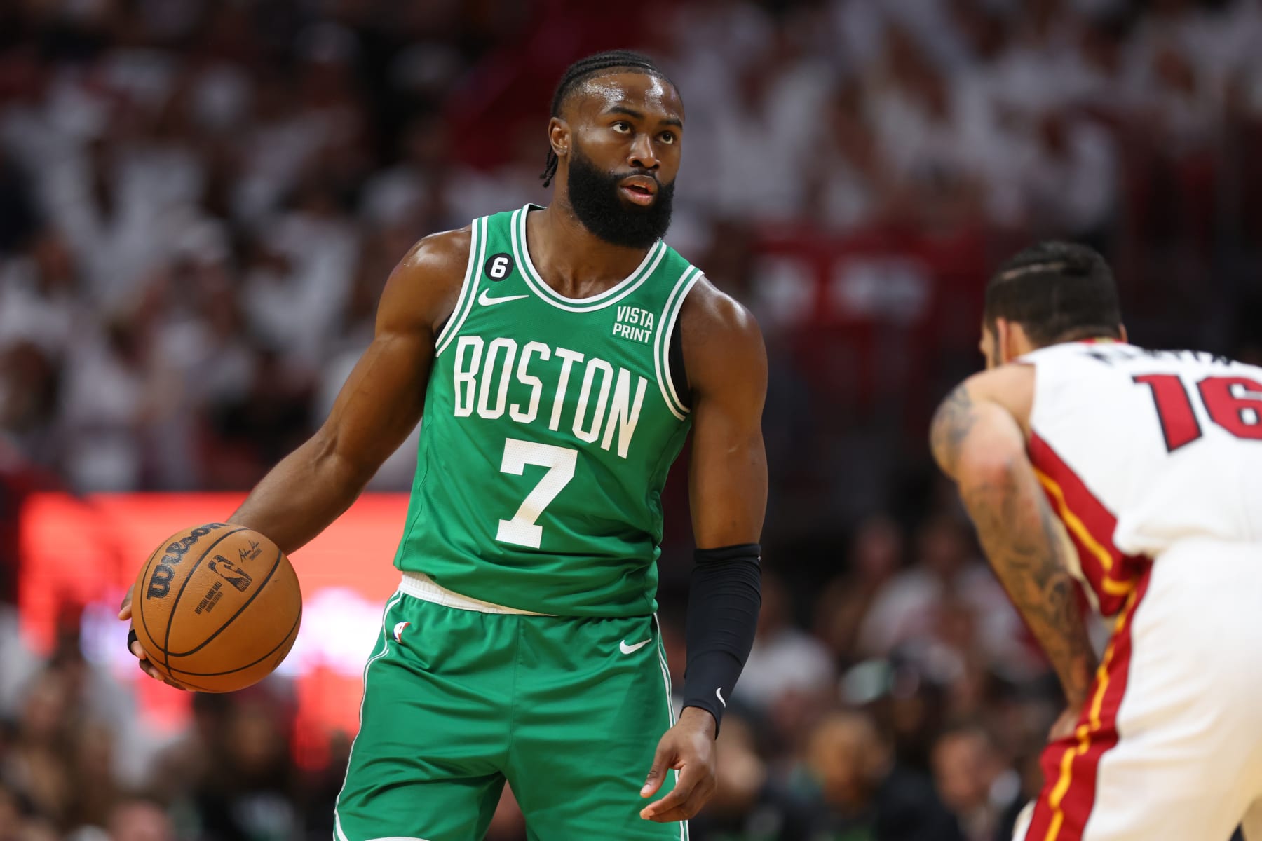 MIAMI, FLORIDA - MAY 27: Jaylen Brown #7 of the Boston Celtics controls the ball ahead of Caleb Martin #16 of the Miami Heat during the first quarter in game six of the Eastern Conference Finals at Kaseya Center on May 27, 2023 in Miami, Florida. NOTE TO USER: User expressly acknowledges and agrees that, by downloading and or using this photograph, User is consenting to the terms and conditions of the Getty Images License Agreement. (Photo by Mike Ehrmann/Getty Images)