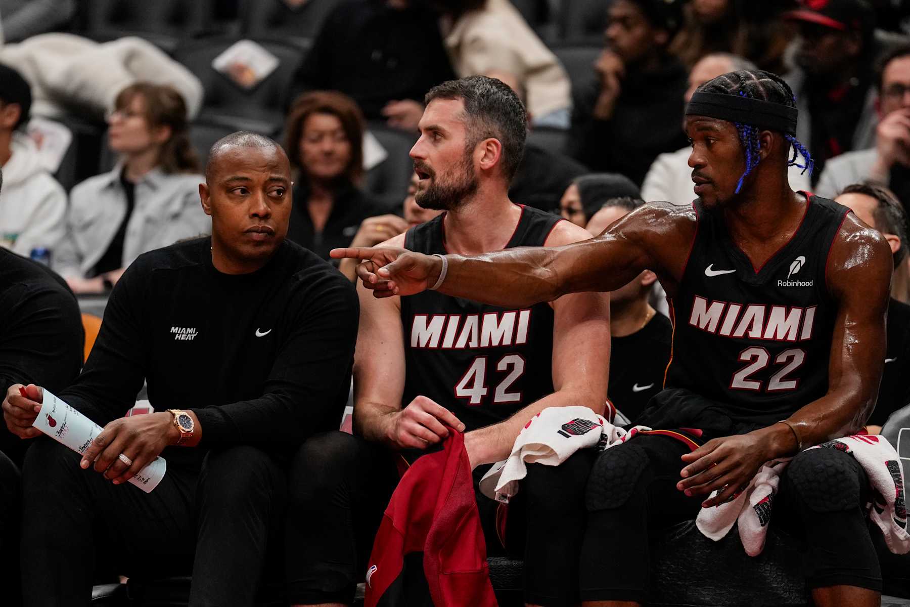 TORONTO, ON - DECEMBER 1: Assistant coach 
Caron Butler of the Miami Heat talks to Kevin Love #42 and Jimmy Butler #22 during their game against the Toronto Raptors at Scotiabank Arena on December 1, 2024 in Toronto, Ontario, Canada. NOTE TO USER: User expressly acknowledges and agrees that, by downloading and/or using this Photograph, user is consenting to the terms and conditions of the Getty Images License Agreement. (Photo by Andrew Lahodynskyj/Getty Images)