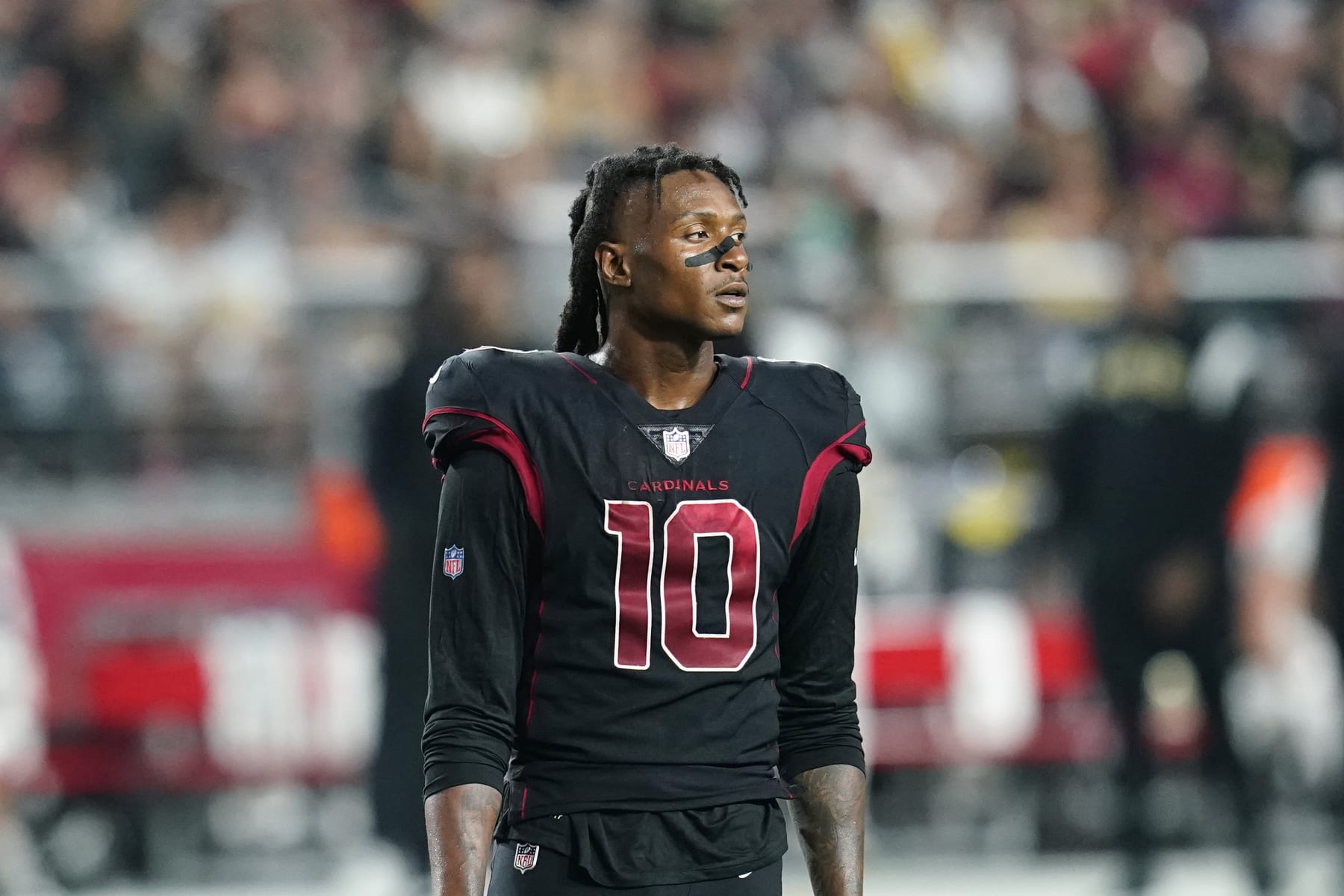 Arizona Cardinals wide receiver DeAndre Hopkins pauses on the field during the second half of an NFL football game against the New Orleans Saints, Thursday, Oct. 20, 2022, in Glendale, Ariz. (AP Photo/Ross D. Franklin)