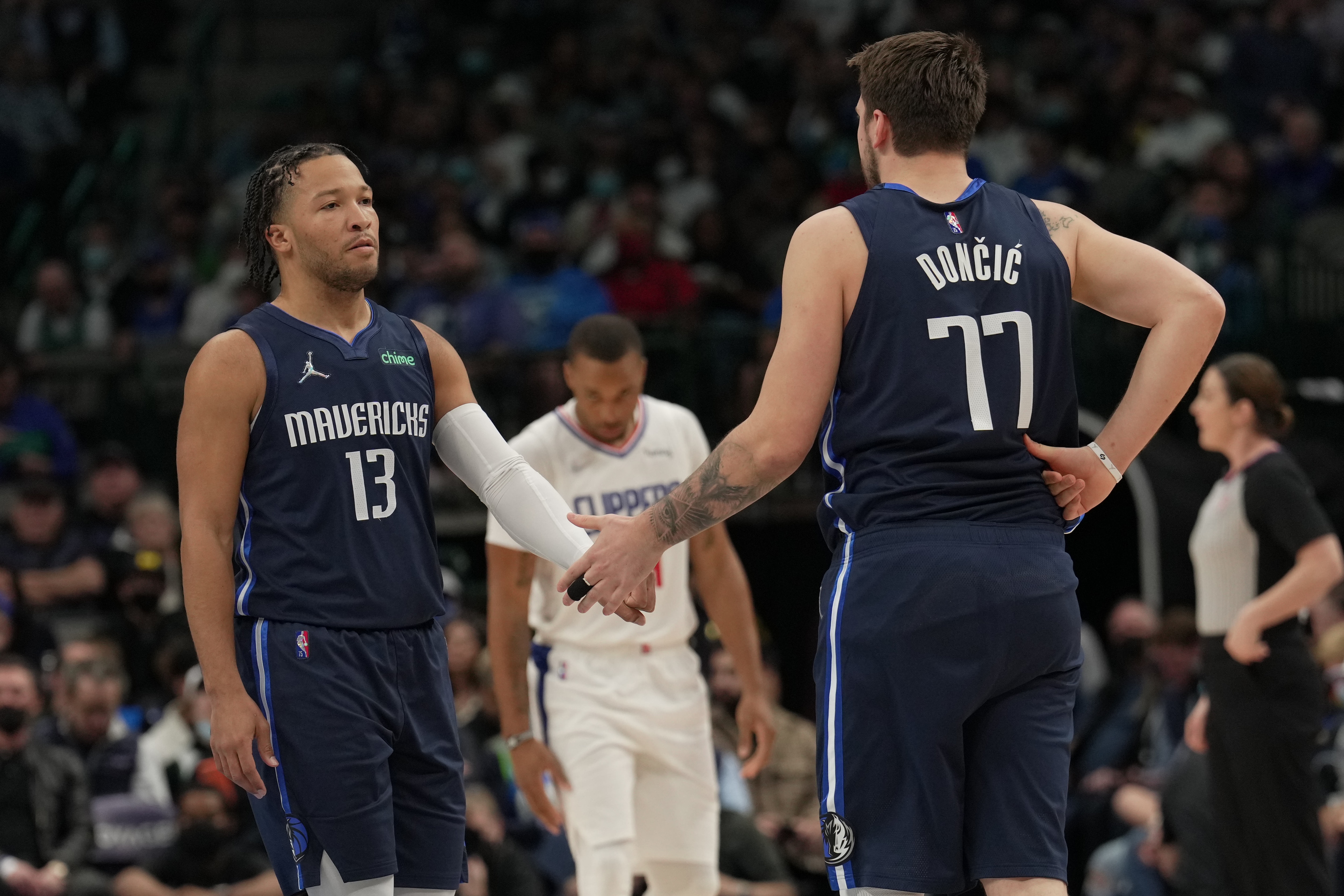 DALLAS, TX - FEBRUARY 10: Jalen Brunson #13 and Luka Doncic #77 of the Dallas Mavericks high five during the game against the Los Angeles Clippers on February 10, 2022 at the American Airlines Center in Dallas, Texas. NOTE TO USER: User expressly acknowledges and agrees that, by downloading and or using this photograph, User is consenting to the terms and conditions of the Getty Images License Agreement. Mandatory Copyright Notice: Copyright 2022 NBAE (Photo by Glenn James/NBAE via Getty Images)