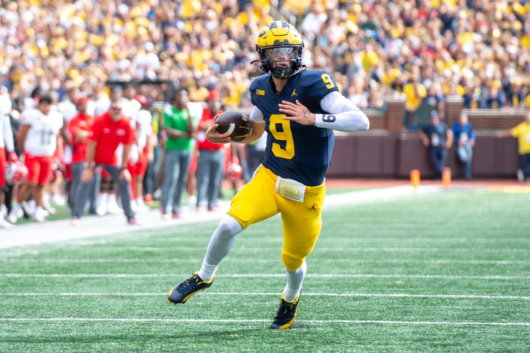 ANN ARBOR, MICHIGAN - SEPTEMBER 09: J.J. McCarthy #9 of the Michigan Wolverines runs with the ball for yardage during the first half of a college football game against the UNLV Rebels at Michigan Stadium on September 09, 2023 in Ann Arbor, Michigan. (Photo by Aaron J. Thornton/Getty Images)